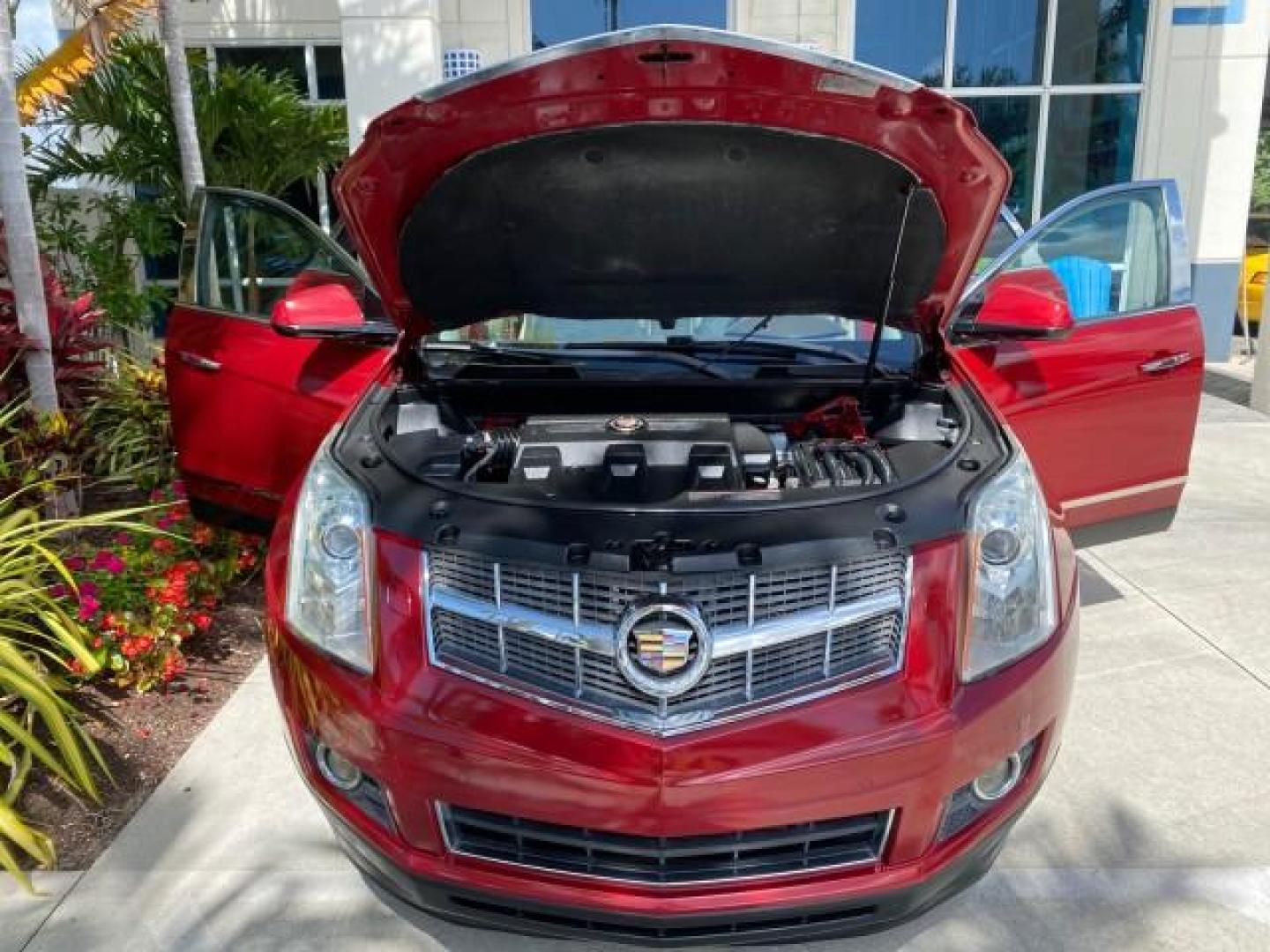 2012 Crystal Red Tintcoat /Shale w/Brownstone accents Cadillac SRX Performance Collection LOW MILES 34,731 (3GYFNBE32CS) with an 3.6L SIDI DOHC V6 VVT Engine engine, Automatic transmission, located at 4701 North Dixie Hwy, Pompano Beach, FL, 33064, (954) 422-2889, 26.240938, -80.123474 - OUR WEBPAGE FLORIDACARS1.COM HAS OVER 100 PHOTOS AND FREE CARFAX LINK 2012 Cadillac SRX 1 OWNER 4 Door Wagon/Sport Utility 3.6L V6 F DOHC 24V Gasoline 24 MPG Front Wheel Drive Features 20 Inch Plus Wheels ABS Brakes Air Conditioning Alloy Wheels AM/FM Stereo Automatic Transmission Auxiliary Audio In- Photo#17