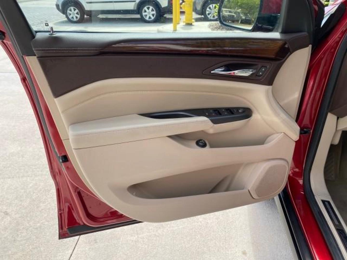 2012 Crystal Red Tintcoat /Shale w/Brownstone accents Cadillac SRX Performance Collection LOW MILES 34,731 (3GYFNBE32CS) with an 3.6L SIDI DOHC V6 VVT Engine engine, Automatic transmission, located at 4701 North Dixie Hwy, Pompano Beach, FL, 33064, (954) 422-2889, 26.240938, -80.123474 - OUR WEBPAGE FLORIDACARS1.COM HAS OVER 100 PHOTOS AND FREE CARFAX LINK 2012 Cadillac SRX 1 OWNER 4 Door Wagon/Sport Utility 3.6L V6 F DOHC 24V Gasoline 24 MPG Front Wheel Drive Features 20 Inch Plus Wheels ABS Brakes Air Conditioning Alloy Wheels AM/FM Stereo Automatic Transmission Auxiliary Audio In- Photo#41