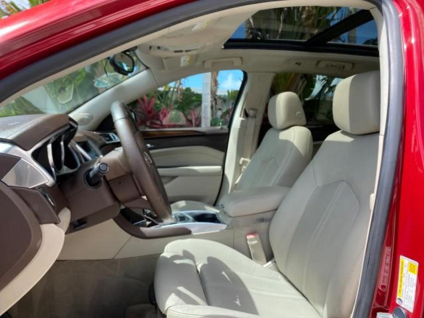 2012 Crystal Red Tintcoat /Shale w/Brownstone accents Cadillac SRX Performance Collection LOW MILES 34,731 (3GYFNBE32CS) with an 3.6L SIDI DOHC V6 VVT Engine engine, Automatic transmission, located at 4701 North Dixie Hwy, Pompano Beach, FL, 33064, (954) 422-2889, 26.240938, -80.123474 - OUR WEBPAGE FLORIDACARS1.COM HAS OVER 100 PHOTOS AND FREE CARFAX LINK 2012 Cadillac SRX 1 OWNER 4 Door Wagon/Sport Utility 3.6L V6 F DOHC 24V Gasoline 24 MPG Front Wheel Drive Features 20 Inch Plus Wheels ABS Brakes Air Conditioning Alloy Wheels AM/FM Stereo Automatic Transmission Auxiliary Audio In- Photo#43