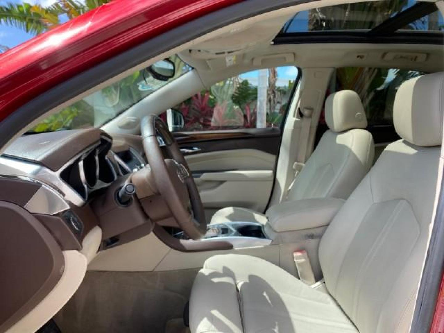 2012 Crystal Red Tintcoat /Shale w/Brownstone accents Cadillac SRX Performance Collection LOW MILES 34,731 (3GYFNBE32CS) with an 3.6L SIDI DOHC V6 VVT Engine engine, Automatic transmission, located at 4701 North Dixie Hwy, Pompano Beach, FL, 33064, (954) 422-2889, 26.240938, -80.123474 - OUR WEBPAGE FLORIDACARS1.COM HAS OVER 100 PHOTOS AND FREE CARFAX LINK 2012 Cadillac SRX 1 OWNER 4 Door Wagon/Sport Utility 3.6L V6 F DOHC 24V Gasoline 24 MPG Front Wheel Drive Features 20 Inch Plus Wheels ABS Brakes Air Conditioning Alloy Wheels AM/FM Stereo Automatic Transmission Auxiliary Audio In- Photo#44