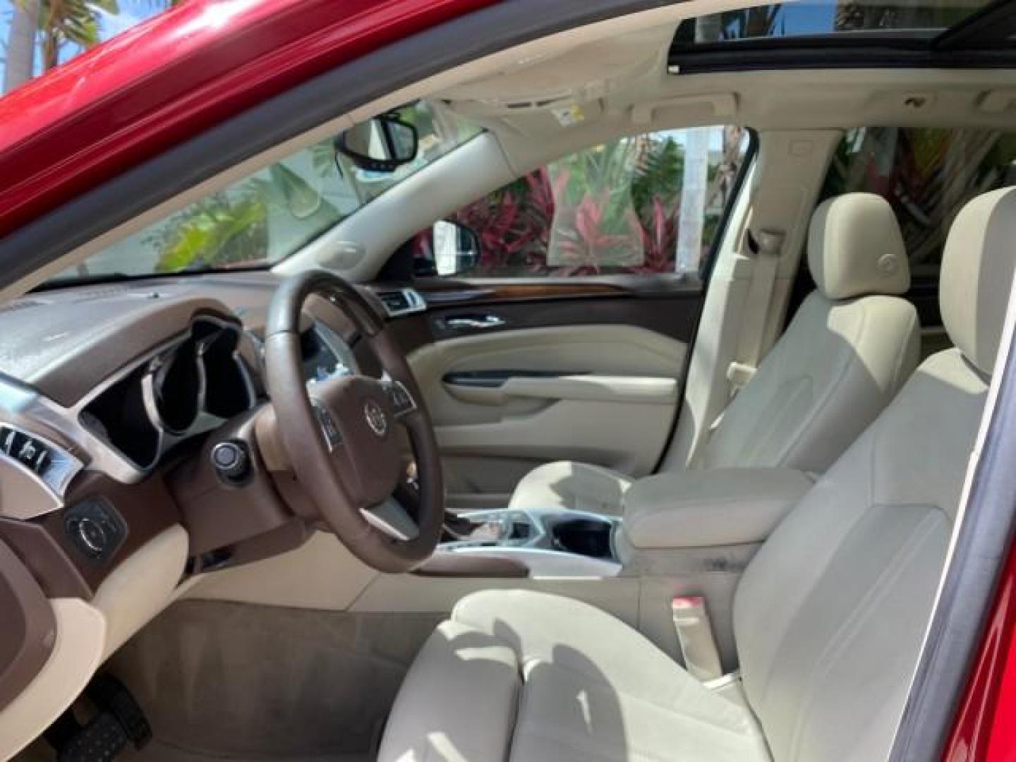 2012 Crystal Red Tintcoat /Shale w/Brownstone accents Cadillac SRX Performance Collection LOW MILES 34,731 (3GYFNBE32CS) with an 3.6L SIDI DOHC V6 VVT Engine engine, Automatic transmission, located at 4701 North Dixie Hwy, Pompano Beach, FL, 33064, (954) 422-2889, 26.240938, -80.123474 - OUR WEBPAGE FLORIDACARS1.COM HAS OVER 100 PHOTOS AND FREE CARFAX LINK 2012 Cadillac SRX 1 OWNER 4 Door Wagon/Sport Utility 3.6L V6 F DOHC 24V Gasoline 24 MPG Front Wheel Drive Features 20 Inch Plus Wheels ABS Brakes Air Conditioning Alloy Wheels AM/FM Stereo Automatic Transmission Auxiliary Audio In- Photo#45