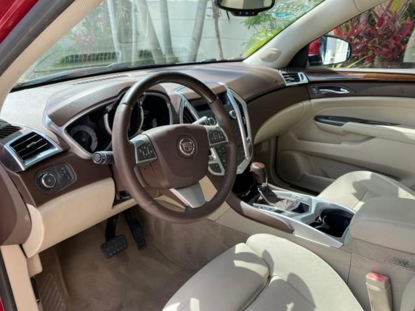 2012 Crystal Red Tintcoat /Shale w/Brownstone accents Cadillac SRX Performance Collection LOW MILES 34,731 (3GYFNBE32CS) with an 3.6L SIDI DOHC V6 VVT Engine engine, Automatic transmission, located at 4701 North Dixie Hwy, Pompano Beach, FL, 33064, (954) 422-2889, 26.240938, -80.123474 - OUR WEBPAGE FLORIDACARS1.COM HAS OVER 100 PHOTOS AND FREE CARFAX LINK 2012 Cadillac SRX 1 OWNER 4 Door Wagon/Sport Utility 3.6L V6 F DOHC 24V Gasoline 24 MPG Front Wheel Drive Features 20 Inch Plus Wheels ABS Brakes Air Conditioning Alloy Wheels AM/FM Stereo Automatic Transmission Auxiliary Audio In- Photo#47