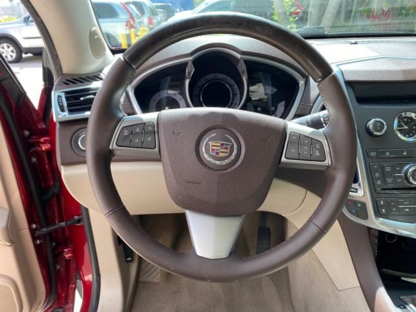 2012 Crystal Red Tintcoat /Shale w/Brownstone accents Cadillac SRX Performance Collection LOW MILES 34,731 (3GYFNBE32CS) with an 3.6L SIDI DOHC V6 VVT Engine engine, Automatic transmission, located at 4701 North Dixie Hwy, Pompano Beach, FL, 33064, (954) 422-2889, 26.240938, -80.123474 - OUR WEBPAGE FLORIDACARS1.COM HAS OVER 100 PHOTOS AND FREE CARFAX LINK 2012 Cadillac SRX 1 OWNER 4 Door Wagon/Sport Utility 3.6L V6 F DOHC 24V Gasoline 24 MPG Front Wheel Drive Features 20 Inch Plus Wheels ABS Brakes Air Conditioning Alloy Wheels AM/FM Stereo Automatic Transmission Auxiliary Audio In- Photo#48