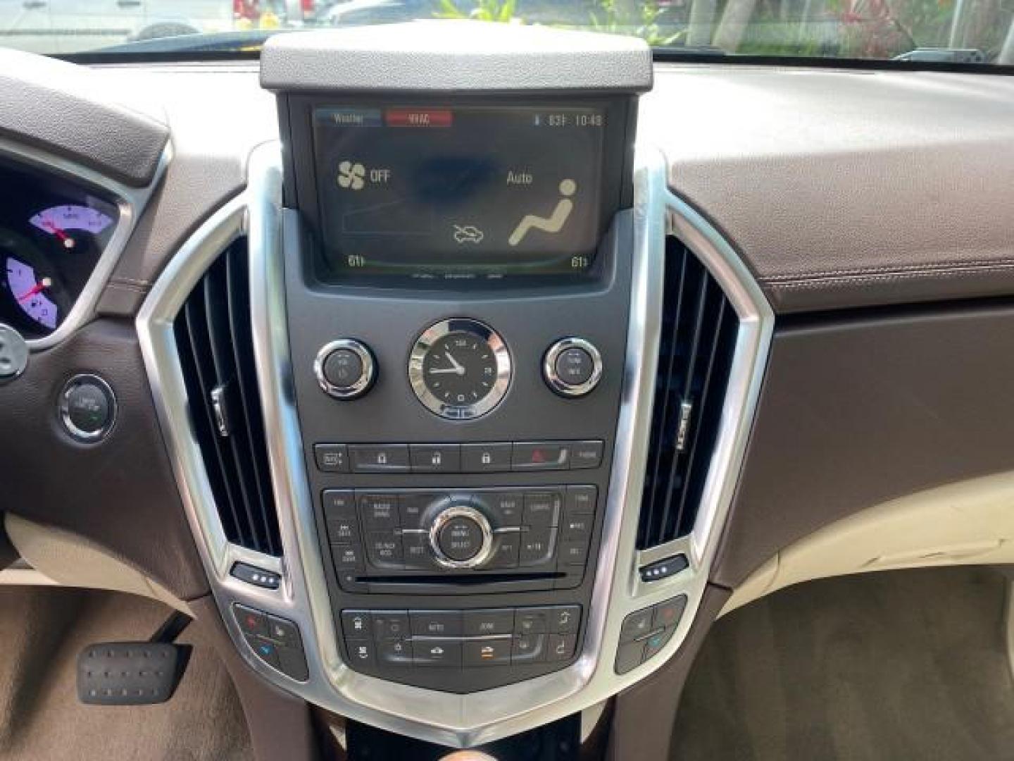 2012 Crystal Red Tintcoat /Shale w/Brownstone accents Cadillac SRX Performance Collection LOW MILES 34,731 (3GYFNBE32CS) with an 3.6L SIDI DOHC V6 VVT Engine engine, Automatic transmission, located at 4701 North Dixie Hwy, Pompano Beach, FL, 33064, (954) 422-2889, 26.240938, -80.123474 - OUR WEBPAGE FLORIDACARS1.COM HAS OVER 100 PHOTOS AND FREE CARFAX LINK 2012 Cadillac SRX 1 OWNER 4 Door Wagon/Sport Utility 3.6L V6 F DOHC 24V Gasoline 24 MPG Front Wheel Drive Features 20 Inch Plus Wheels ABS Brakes Air Conditioning Alloy Wheels AM/FM Stereo Automatic Transmission Auxiliary Audio In- Photo#56