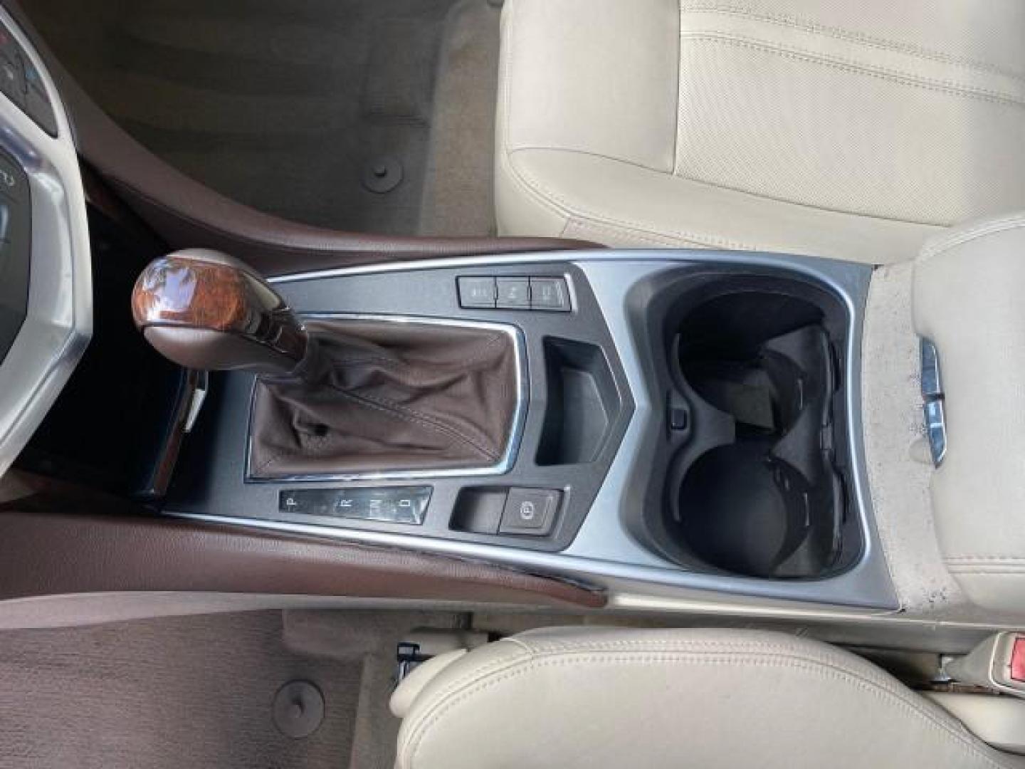 2012 Crystal Red Tintcoat /Shale w/Brownstone accents Cadillac SRX Performance Collection LOW MILES 34,731 (3GYFNBE32CS) with an 3.6L SIDI DOHC V6 VVT Engine engine, Automatic transmission, located at 4701 North Dixie Hwy, Pompano Beach, FL, 33064, (954) 422-2889, 26.240938, -80.123474 - OUR WEBPAGE FLORIDACARS1.COM HAS OVER 100 PHOTOS AND FREE CARFAX LINK 2012 Cadillac SRX 1 OWNER 4 Door Wagon/Sport Utility 3.6L V6 F DOHC 24V Gasoline 24 MPG Front Wheel Drive Features 20 Inch Plus Wheels ABS Brakes Air Conditioning Alloy Wheels AM/FM Stereo Automatic Transmission Auxiliary Audio In- Photo#63