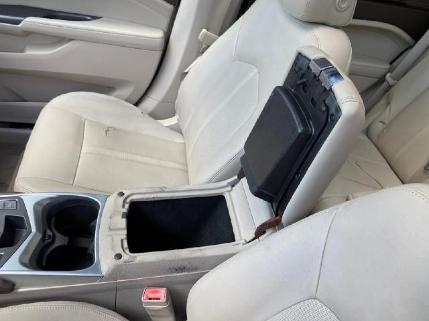 2012 Crystal Red Tintcoat /Shale w/Brownstone accents Cadillac SRX Performance Collection LOW MILES 34,731 (3GYFNBE32CS) with an 3.6L SIDI DOHC V6 VVT Engine engine, Automatic transmission, located at 4701 North Dixie Hwy, Pompano Beach, FL, 33064, (954) 422-2889, 26.240938, -80.123474 - OUR WEBPAGE FLORIDACARS1.COM HAS OVER 100 PHOTOS AND FREE CARFAX LINK 2012 Cadillac SRX 1 OWNER 4 Door Wagon/Sport Utility 3.6L V6 F DOHC 24V Gasoline 24 MPG Front Wheel Drive Features 20 Inch Plus Wheels ABS Brakes Air Conditioning Alloy Wheels AM/FM Stereo Automatic Transmission Auxiliary Audio In- Photo#65