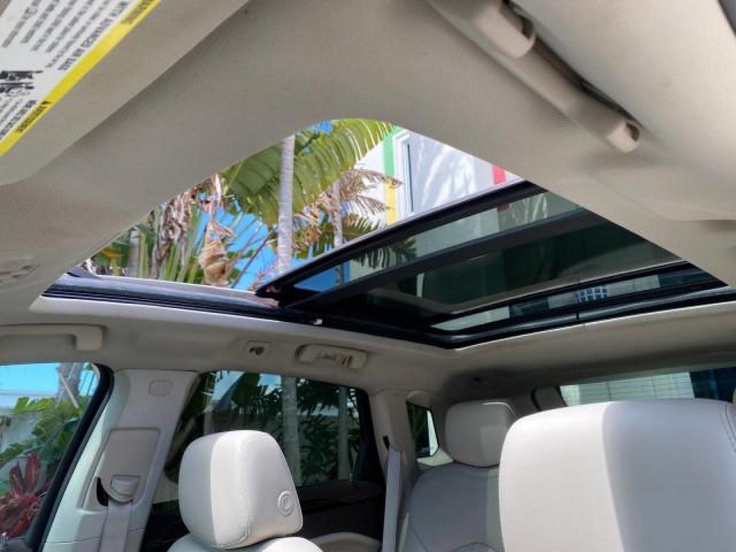 2012 Crystal Red Tintcoat /Shale w/Brownstone accents Cadillac SRX Performance Collection LOW MILES 34,731 (3GYFNBE32CS) with an 3.6L SIDI DOHC V6 VVT Engine engine, Automatic transmission, located at 4701 North Dixie Hwy, Pompano Beach, FL, 33064, (954) 422-2889, 26.240938, -80.123474 - OUR WEBPAGE FLORIDACARS1.COM HAS OVER 100 PHOTOS AND FREE CARFAX LINK 2012 Cadillac SRX 1 OWNER 4 Door Wagon/Sport Utility 3.6L V6 F DOHC 24V Gasoline 24 MPG Front Wheel Drive Features 20 Inch Plus Wheels ABS Brakes Air Conditioning Alloy Wheels AM/FM Stereo Automatic Transmission Auxiliary Audio In- Photo#74