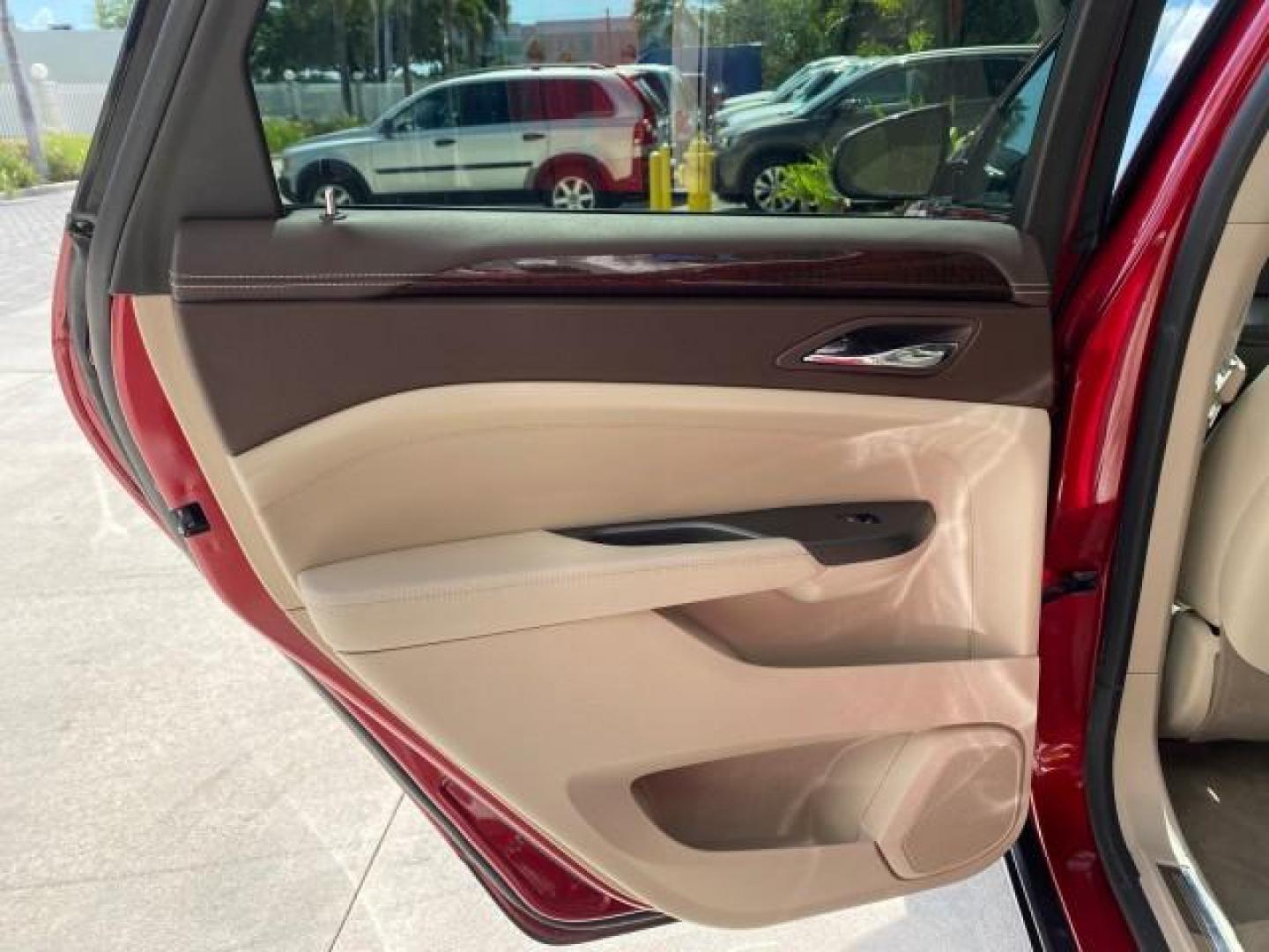 2012 Crystal Red Tintcoat /Shale w/Brownstone accents Cadillac SRX Performance Collection LOW MILES 34,731 (3GYFNBE32CS) with an 3.6L SIDI DOHC V6 VVT Engine engine, Automatic transmission, located at 4701 North Dixie Hwy, Pompano Beach, FL, 33064, (954) 422-2889, 26.240938, -80.123474 - OUR WEBPAGE FLORIDACARS1.COM HAS OVER 100 PHOTOS AND FREE CARFAX LINK 2012 Cadillac SRX 1 OWNER 4 Door Wagon/Sport Utility 3.6L V6 F DOHC 24V Gasoline 24 MPG Front Wheel Drive Features 20 Inch Plus Wheels ABS Brakes Air Conditioning Alloy Wheels AM/FM Stereo Automatic Transmission Auxiliary Audio In- Photo#79
