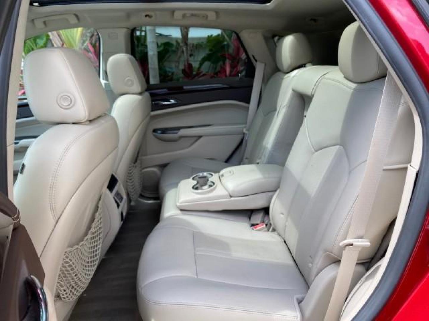 2012 Crystal Red Tintcoat /Shale w/Brownstone accents Cadillac SRX Performance Collection LOW MILES 34,731 (3GYFNBE32CS) with an 3.6L SIDI DOHC V6 VVT Engine engine, Automatic transmission, located at 4701 North Dixie Hwy, Pompano Beach, FL, 33064, (954) 422-2889, 26.240938, -80.123474 - OUR WEBPAGE FLORIDACARS1.COM HAS OVER 100 PHOTOS AND FREE CARFAX LINK 2012 Cadillac SRX 1 OWNER 4 Door Wagon/Sport Utility 3.6L V6 F DOHC 24V Gasoline 24 MPG Front Wheel Drive Features 20 Inch Plus Wheels ABS Brakes Air Conditioning Alloy Wheels AM/FM Stereo Automatic Transmission Auxiliary Audio In- Photo#80