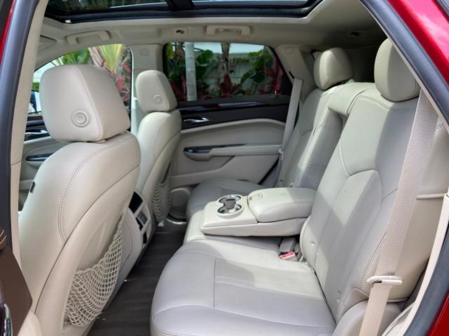 2012 Crystal Red Tintcoat /Shale w/Brownstone accents Cadillac SRX Performance Collection LOW MILES 34,731 (3GYFNBE32CS) with an 3.6L SIDI DOHC V6 VVT Engine engine, Automatic transmission, located at 4701 North Dixie Hwy, Pompano Beach, FL, 33064, (954) 422-2889, 26.240938, -80.123474 - OUR WEBPAGE FLORIDACARS1.COM HAS OVER 100 PHOTOS AND FREE CARFAX LINK 2012 Cadillac SRX 1 OWNER 4 Door Wagon/Sport Utility 3.6L V6 F DOHC 24V Gasoline 24 MPG Front Wheel Drive Features 20 Inch Plus Wheels ABS Brakes Air Conditioning Alloy Wheels AM/FM Stereo Automatic Transmission Auxiliary Audio In- Photo#81
