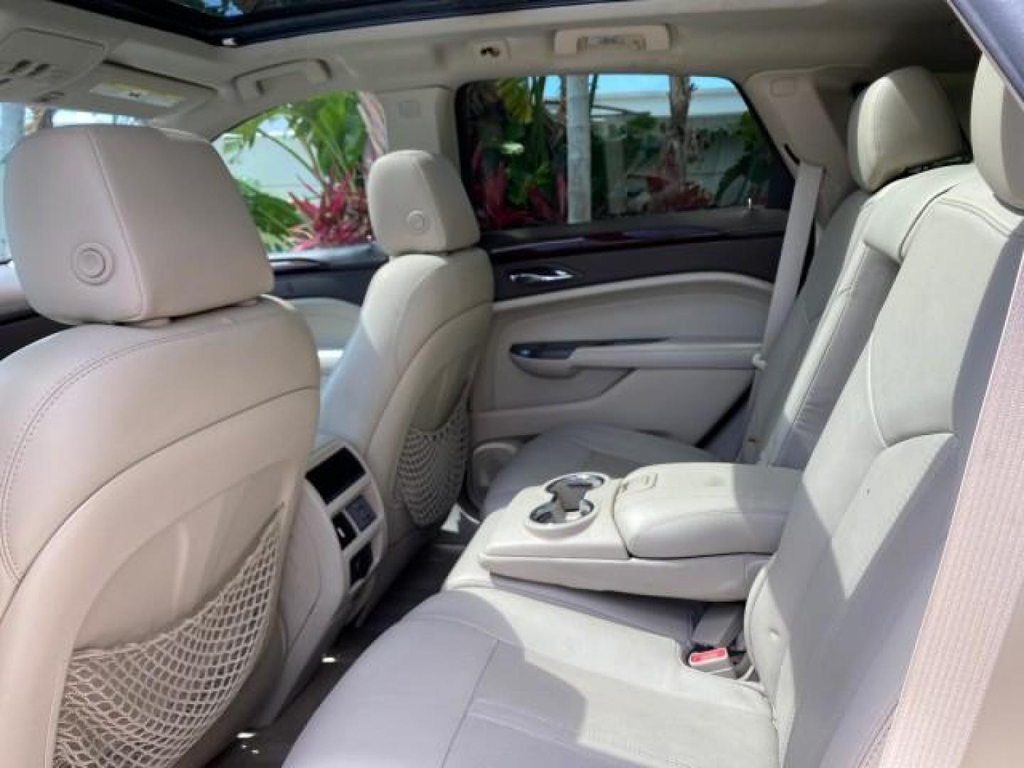 2012 Crystal Red Tintcoat /Shale w/Brownstone accents Cadillac SRX Performance Collection LOW MILES 34,731 (3GYFNBE32CS) with an 3.6L SIDI DOHC V6 VVT Engine engine, Automatic transmission, located at 4701 North Dixie Hwy, Pompano Beach, FL, 33064, (954) 422-2889, 26.240938, -80.123474 - OUR WEBPAGE FLORIDACARS1.COM HAS OVER 100 PHOTOS AND FREE CARFAX LINK 2012 Cadillac SRX 1 OWNER 4 Door Wagon/Sport Utility 3.6L V6 F DOHC 24V Gasoline 24 MPG Front Wheel Drive Features 20 Inch Plus Wheels ABS Brakes Air Conditioning Alloy Wheels AM/FM Stereo Automatic Transmission Auxiliary Audio In- Photo#82
