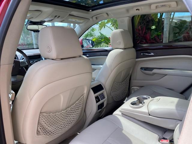 2012 Crystal Red Tintcoat /Shale w/Brownstone accents Cadillac SRX Performance Collection LOW MILES 34,731 (3GYFNBE32CS) with an 3.6L SIDI DOHC V6 VVT Engine engine, Automatic transmission, located at 4701 North Dixie Hwy, Pompano Beach, FL, 33064, (954) 422-2889, 26.240938, -80.123474 - OUR WEBPAGE FLORIDACARS1.COM HAS OVER 100 PHOTOS AND FREE CARFAX LINK 2012 Cadillac SRX 1 OWNER 4 Door Wagon/Sport Utility 3.6L V6 F DOHC 24V Gasoline 24 MPG Front Wheel Drive Features 20 Inch Plus Wheels ABS Brakes Air Conditioning Alloy Wheels AM/FM Stereo Automatic Transmission Auxiliary Audio In - Photo#83