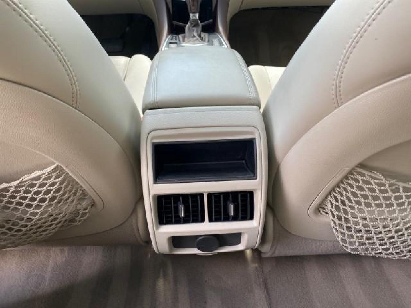 2012 Crystal Red Tintcoat /Shale w/Brownstone accents Cadillac SRX Performance Collection LOW MILES 34,731 (3GYFNBE32CS) with an 3.6L SIDI DOHC V6 VVT Engine engine, Automatic transmission, located at 4701 North Dixie Hwy, Pompano Beach, FL, 33064, (954) 422-2889, 26.240938, -80.123474 - OUR WEBPAGE FLORIDACARS1.COM HAS OVER 100 PHOTOS AND FREE CARFAX LINK 2012 Cadillac SRX 1 OWNER 4 Door Wagon/Sport Utility 3.6L V6 F DOHC 24V Gasoline 24 MPG Front Wheel Drive Features 20 Inch Plus Wheels ABS Brakes Air Conditioning Alloy Wheels AM/FM Stereo Automatic Transmission Auxiliary Audio In- Photo#85