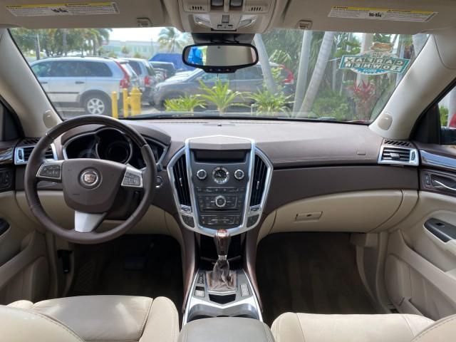 2012 Crystal Red Tintcoat /Shale w/Brownstone accents Cadillac SRX Performance Collection LOW MILES 34,731 (3GYFNBE32CS) with an 3.6L SIDI DOHC V6 VVT Engine engine, Automatic transmission, located at 4701 North Dixie Hwy, Pompano Beach, FL, 33064, (954) 422-2889, 26.240938, -80.123474 - OUR WEBPAGE FLORIDACARS1.COM HAS OVER 100 PHOTOS AND FREE CARFAX LINK 2012 Cadillac SRX 1 OWNER 4 Door Wagon/Sport Utility 3.6L V6 F DOHC 24V Gasoline 24 MPG Front Wheel Drive Features 20 Inch Plus Wheels ABS Brakes Air Conditioning Alloy Wheels AM/FM Stereo Automatic Transmission Auxiliary Audio In - Photo#86