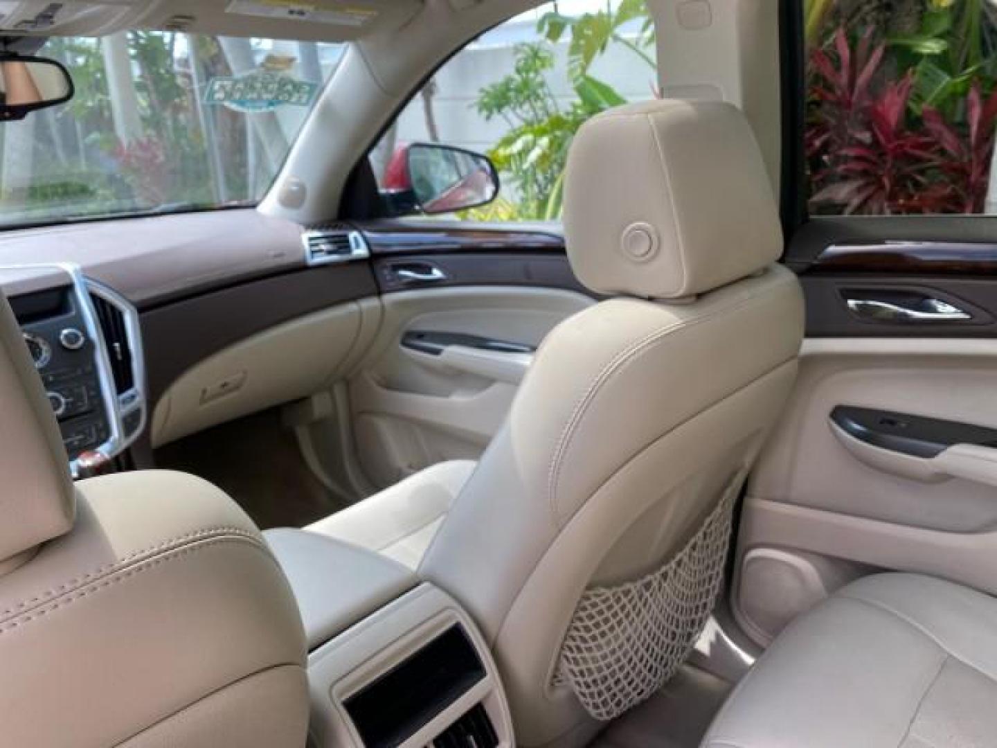 2012 Crystal Red Tintcoat /Shale w/Brownstone accents Cadillac SRX Performance Collection LOW MILES 34,731 (3GYFNBE32CS) with an 3.6L SIDI DOHC V6 VVT Engine engine, Automatic transmission, located at 4701 North Dixie Hwy, Pompano Beach, FL, 33064, (954) 422-2889, 26.240938, -80.123474 - OUR WEBPAGE FLORIDACARS1.COM HAS OVER 100 PHOTOS AND FREE CARFAX LINK 2012 Cadillac SRX 1 OWNER 4 Door Wagon/Sport Utility 3.6L V6 F DOHC 24V Gasoline 24 MPG Front Wheel Drive Features 20 Inch Plus Wheels ABS Brakes Air Conditioning Alloy Wheels AM/FM Stereo Automatic Transmission Auxiliary Audio In- Photo#89