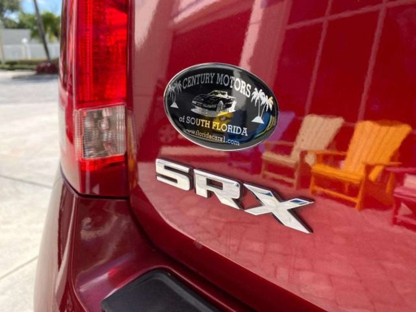 2012 Crystal Red Tintcoat /Shale w/Brownstone accents Cadillac SRX Performance Collection LOW MILES 34,731 (3GYFNBE32CS) with an 3.6L SIDI DOHC V6 VVT Engine engine, Automatic transmission, located at 4701 North Dixie Hwy, Pompano Beach, FL, 33064, (954) 422-2889, 26.240938, -80.123474 - OUR WEBPAGE FLORIDACARS1.COM HAS OVER 100 PHOTOS AND FREE CARFAX LINK 2012 Cadillac SRX 1 OWNER 4 Door Wagon/Sport Utility 3.6L V6 F DOHC 24V Gasoline 24 MPG Front Wheel Drive Features 20 Inch Plus Wheels ABS Brakes Air Conditioning Alloy Wheels AM/FM Stereo Automatic Transmission Auxiliary Audio In- Photo#94