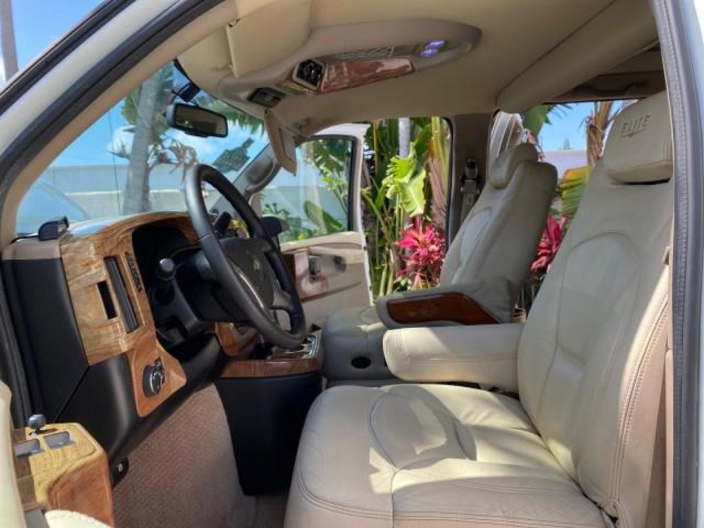 2012 Summit White /Neutral Chevrolet Express EXTENDED HIGH TOP CONVERSION 1 OWNER LOW MILES 36,054 (1GBWGLCG9C1) with an 6.0L Vortec 1000 V8 SFI Flex-Fuel Engine engine, Automatic transmission, located at 4701 North Dixie Hwy, Pompano Beach, FL, 33064, (954) 422-2889, 26.240938, -80.123474 - OUR WEBPAGE FLORIDACARS1.COM HAS OVER 100 PHOTOS AND FREE CARFAX LINK 2012 Chevrolet Express EXTENDED HIGH TOP CONVERSION VAN 1 OWNER Van 6.0L V8 F OHV 16V Flex Fuel 15 MPG Rear Wheel Drive Features ABS Brakes Air Conditioning Alloy Wheels AM/FM Stereo Automatic Transmission Auxiliary Audio Input Bl- Photo#10