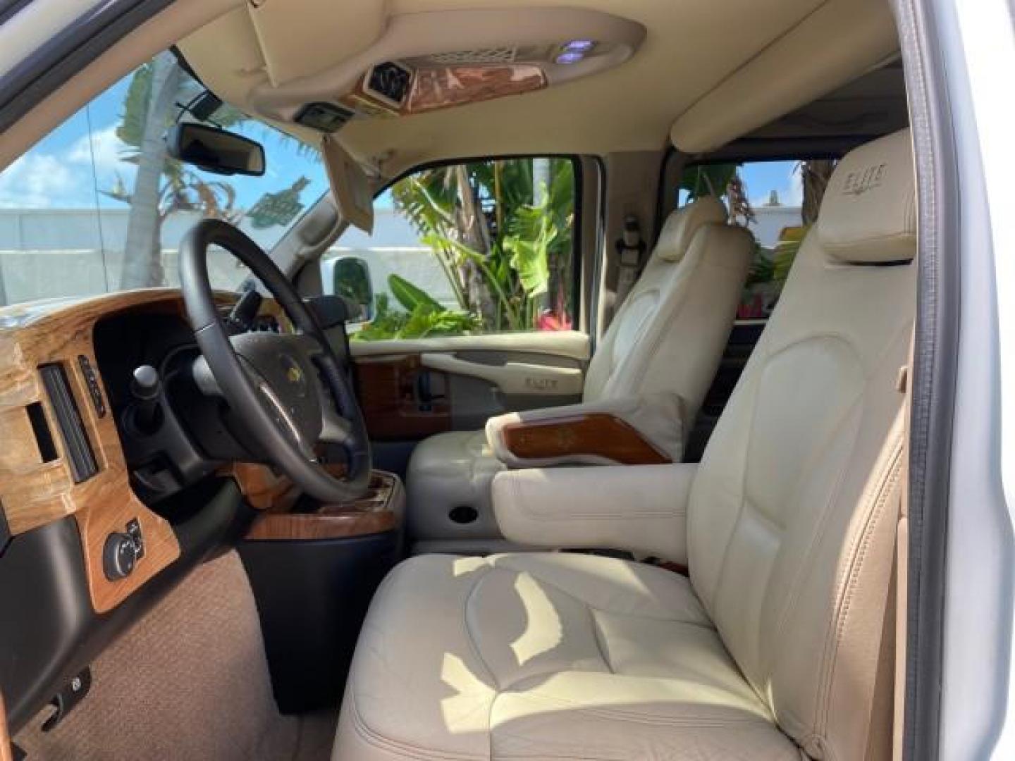 2012 Summit White /Neutral Chevrolet Express EXTENDED HIGH TOP CONVERSION 1 OWNER LOW MILES 36,054 (1GBWGLCG9C1) with an 6.0L Vortec 1000 V8 SFI Flex-Fuel Engine engine, Automatic transmission, located at 4701 North Dixie Hwy, Pompano Beach, FL, 33064, (954) 422-2889, 26.240938, -80.123474 - OUR WEBPAGE FLORIDACARS1.COM HAS OVER 100 PHOTOS AND FREE CARFAX LINK 2012 Chevrolet Express EXTENDED HIGH TOP CONVERSION VAN 1 OWNER Van 6.0L V8 F OHV 16V Flex Fuel 15 MPG Rear Wheel Drive Features ABS Brakes Air Conditioning Alloy Wheels AM/FM Stereo Automatic Transmission Auxiliary Audio Input Bl- Photo#44