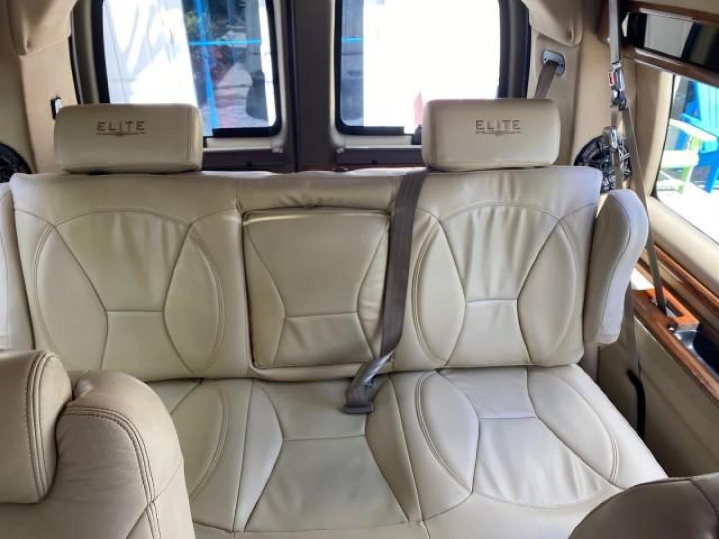 2012 Summit White /Neutral Chevrolet Express EXTENDED HIGH TOP CONVERSION 1 OWNER LOW MILES 36,054 (1GBWGLCG9C1) with an 6.0L Vortec 1000 V8 SFI Flex-Fuel Engine engine, Automatic transmission, located at 4701 North Dixie Hwy, Pompano Beach, FL, 33064, (954) 422-2889, 26.240938, -80.123474 - OUR WEBPAGE FLORIDACARS1.COM HAS OVER 100 PHOTOS AND FREE CARFAX LINK 2012 Chevrolet Express EXTENDED HIGH TOP CONVERSION VAN 1 OWNER Van 6.0L V8 F OHV 16V Flex Fuel 15 MPG Rear Wheel Drive Features ABS Brakes Air Conditioning Alloy Wheels AM/FM Stereo Automatic Transmission Auxiliary Audio Input Bl- Photo#81