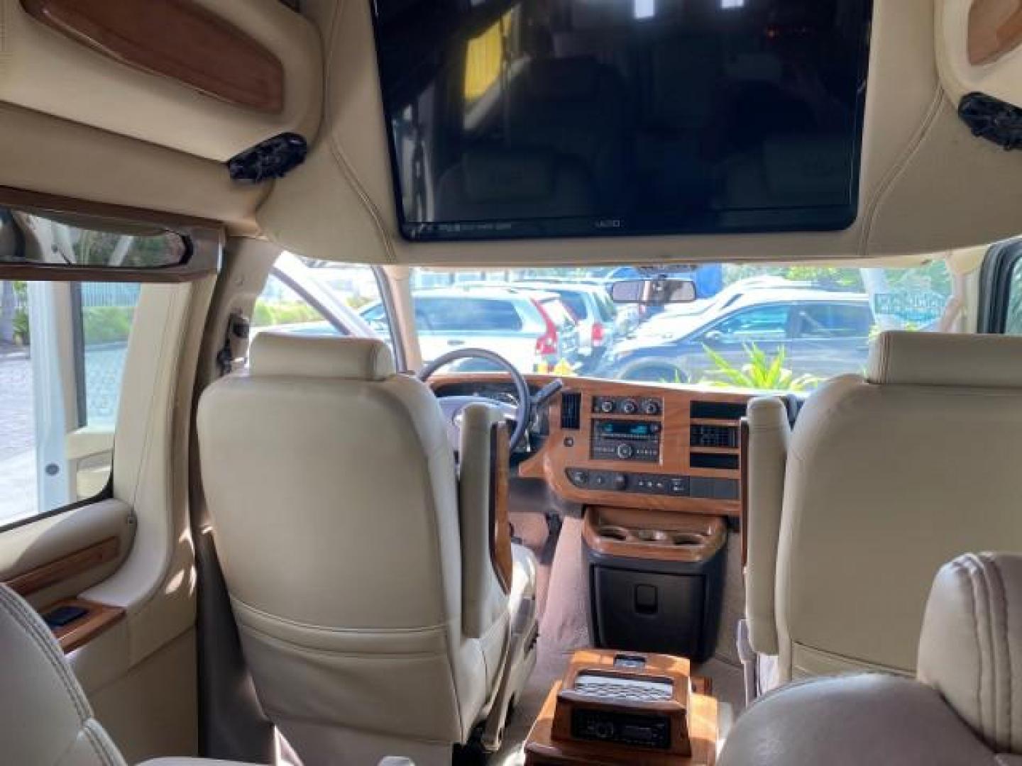 2012 Summit White /Neutral Chevrolet Express EXTENDED HIGH TOP CONVERSION 1 OWNER LOW MILES 36,054 (1GBWGLCG9C1) with an 6.0L Vortec 1000 V8 SFI Flex-Fuel Engine engine, Automatic transmission, located at 4701 North Dixie Hwy, Pompano Beach, FL, 33064, (954) 422-2889, 26.240938, -80.123474 - OUR WEBPAGE FLORIDACARS1.COM HAS OVER 100 PHOTOS AND FREE CARFAX LINK 2012 Chevrolet Express EXTENDED HIGH TOP CONVERSION VAN 1 OWNER Van 6.0L V8 F OHV 16V Flex Fuel 15 MPG Rear Wheel Drive Features ABS Brakes Air Conditioning Alloy Wheels AM/FM Stereo Automatic Transmission Auxiliary Audio Input Bl- Photo#94