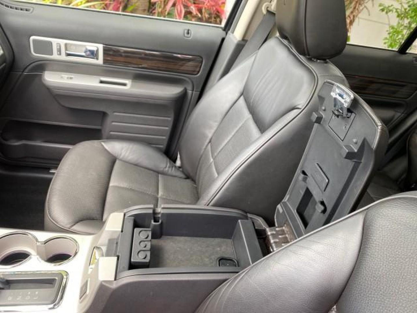 2010 Tuxedo Black Metallic /Charcoal Black Lincoln MKX 1 OWNER LOW MILES 27,203 SUNROOF NAV (2LMDJ6JC7AB) with an 3.5L DOHC 24-Valve V6 Duratec Engine engine, Automatic transmission, located at 4701 North Dixie Hwy, Pompano Beach, FL, 33064, (954) 422-2889, 26.240938, -80.123474 - OUR WEBPAGE FLORIDACARS1.COM HAS OVER 100 PHOTOS AND FREE CARFAX LINK 2010 Lincoln MKX 1 OWNER 4 Door Wagon/Sport Utility 3.5L V6 F DOHC 24V Gasoline 25 MPG Front Wheel Drive Features A/C Seat(s) ABS Brakes Air Conditioning Alloy Wheels AM/FM Stereo Automatic Transmission Auxiliary Audio Input Bluet - Photo#66