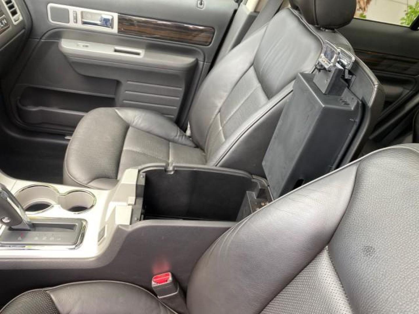 2010 Tuxedo Black Metallic /Charcoal Black Lincoln MKX 1 OWNER LOW MILES 27,203 SUNROOF NAV (2LMDJ6JC7AB) with an 3.5L DOHC 24-Valve V6 Duratec Engine engine, Automatic transmission, located at 4701 North Dixie Hwy, Pompano Beach, FL, 33064, (954) 422-2889, 26.240938, -80.123474 - OUR WEBPAGE FLORIDACARS1.COM HAS OVER 100 PHOTOS AND FREE CARFAX LINK 2010 Lincoln MKX 1 OWNER 4 Door Wagon/Sport Utility 3.5L V6 F DOHC 24V Gasoline 25 MPG Front Wheel Drive Features A/C Seat(s) ABS Brakes Air Conditioning Alloy Wheels AM/FM Stereo Automatic Transmission Auxiliary Audio Input Bluet - Photo#67