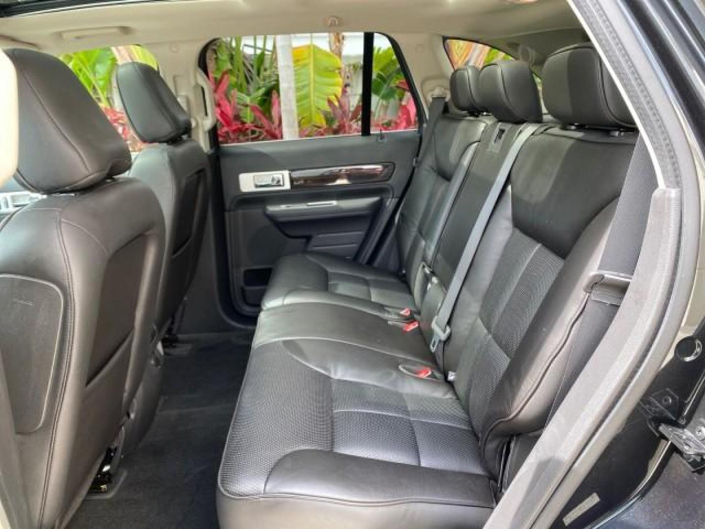 2010 Tuxedo Black Metallic /Charcoal Black Lincoln MKX 1 OWNER LOW MILES 27,203 SUNROOF NAV (2LMDJ6JC7AB) with an 3.5L DOHC 24-Valve V6 Duratec Engine engine, Automatic transmission, located at 4701 North Dixie Hwy, Pompano Beach, FL, 33064, (954) 422-2889, 26.240938, -80.123474 - OUR WEBPAGE FLORIDACARS1.COM HAS OVER 100 PHOTOS AND FREE CARFAX LINK 2010 Lincoln MKX 1 OWNER 4 Door Wagon/Sport Utility 3.5L V6 F DOHC 24V Gasoline 25 MPG Front Wheel Drive Features A/C Seat(s) ABS Brakes Air Conditioning Alloy Wheels AM/FM Stereo Automatic Transmission Auxiliary Audio Input Bluet - Photo#82