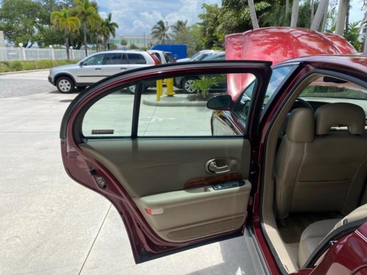 2000 Medium Red Pearl /Taupe Buick LeSabre Limited LEATHER LOW MILES (1G4HR54K1YU) with an 3.8L SFI V6 3800 Series II Engine engine, Automatic transmission, located at 4701 North Dixie Hwy, Pompano Beach, FL, 33064, (954) 422-2889, 26.240938, -80.123474 - OUR WEBPAGE FLORIDACARS1.COM HAS OVER 100 PHOTOS AND FREE CARFAX LINK 2000 Buick Lesabre Limited Sedan 4 DR 3.8L V6 F 12V Gasoline 30 MPG Front Wheel Drive Features ABS Brakes Air Conditioning Alloy Wheels AM/FM Stereo Automatic Transmission Cassette Player CD Audio Cruise Control Leather Seats Powe- Photo#13