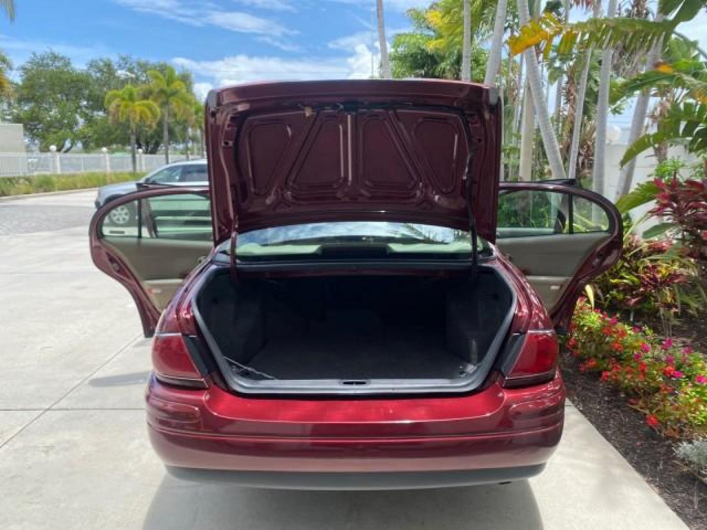 2000 Medium Red Pearl /Taupe Buick LeSabre Limited LEATHER LOW MILES (1G4HR54K1YU) with an 3.8L SFI V6 3800 Series II Engine engine, Automatic transmission, located at 4701 North Dixie Hwy, Pompano Beach, FL, 33064, (954) 422-2889, 26.240938, -80.123474 - OUR WEBPAGE FLORIDACARS1.COM HAS OVER 100 PHOTOS AND FREE CARFAX LINK 2000 Buick Lesabre Limited Sedan 4 DR 3.8L V6 F 12V Gasoline 30 MPG Front Wheel Drive Features ABS Brakes Air Conditioning Alloy Wheels AM/FM Stereo Automatic Transmission Cassette Player CD Audio Cruise Control Leather Seats Powe- Photo#15