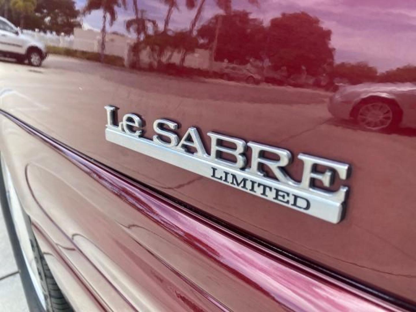 2000 Medium Red Pearl /Taupe Buick LeSabre Limited LEATHER LOW MILES (1G4HR54K1YU) with an 3.8L SFI V6 3800 Series II Engine engine, Automatic transmission, located at 4701 North Dixie Hwy, Pompano Beach, FL, 33064, (954) 422-2889, 26.240938, -80.123474 - OUR WEBPAGE FLORIDACARS1.COM HAS OVER 100 PHOTOS AND FREE CARFAX LINK 2000 Buick Lesabre Limited Sedan 4 DR 3.8L V6 F 12V Gasoline 30 MPG Front Wheel Drive Features ABS Brakes Air Conditioning Alloy Wheels AM/FM Stereo Automatic Transmission Cassette Player CD Audio Cruise Control Leather Seats Powe- Photo#88