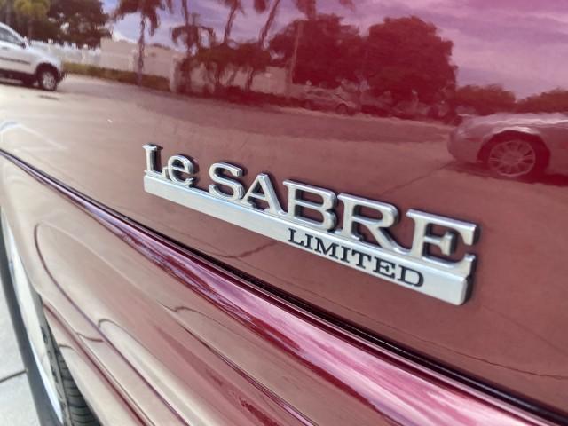 2000 Medium Red Pearl /Taupe Buick LeSabre Limited LEATHER LOW MILES (1G4HR54K1YU) with an 3.8L SFI V6 3800 Series II Engine engine, Automatic transmission, located at 4701 North Dixie Hwy, Pompano Beach, FL, 33064, (954) 422-2889, 26.240938, -80.123474 - OUR WEBPAGE FLORIDACARS1.COM HAS OVER 100 PHOTOS AND FREE CARFAX LINK 2000 Buick Lesabre Limited Sedan 4 DR 3.8L V6 F 12V Gasoline 30 MPG Front Wheel Drive Features ABS Brakes Air Conditioning Alloy Wheels AM/FM Stereo Automatic Transmission Cassette Player CD Audio Cruise Control Leather Seats Powe - Photo#88