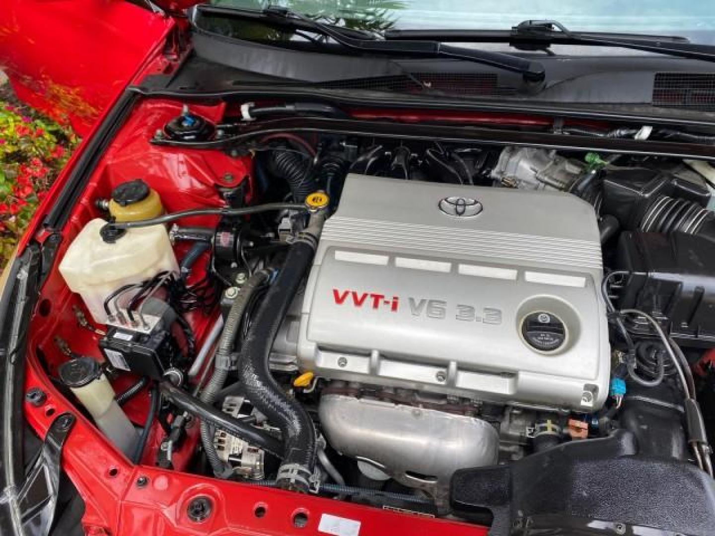 2004 Absolutely Red /Dark Stone Toyota Camry Solara CONV SE 1 OWNER 74972 Mi (4T1FA38P64U) with an 3.3L DOHC SMPI VVT-i 24-Valve V6 Engine engine, Automatic transmission, located at 4701 North Dixie Hwy, Pompano Beach, FL, 33064, (954) 422-2889, 26.240938, -80.123474 - OUR WEBPAGE FLORIDACARS1.COM HAS OVER 100 PHOTOS AND FREE CARFAX LINK 2004 Toyota Camry Solara SE V6 Convertible 3.3L V6 F DOHC 24V Gasoline 29 MPG Front Wheel Drive Features ABS Brakes Air Conditioning Alloy Wheels AM/FM Stereo Automatic Transmission Cassette Player CD Audio Cloth Seats Cruise Cont- Photo#24