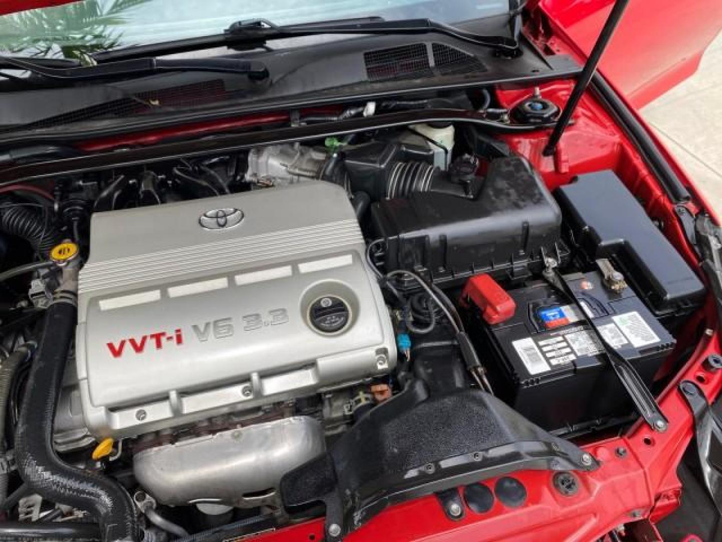 2004 Absolutely Red /Dark Stone Toyota Camry Solara CONV SE 1 OWNER 74972 Mi (4T1FA38P64U) with an 3.3L DOHC SMPI VVT-i 24-Valve V6 Engine engine, Automatic transmission, located at 4701 North Dixie Hwy, Pompano Beach, FL, 33064, (954) 422-2889, 26.240938, -80.123474 - OUR WEBPAGE FLORIDACARS1.COM HAS OVER 100 PHOTOS AND FREE CARFAX LINK 2004 Toyota Camry Solara SE V6 Convertible 3.3L V6 F DOHC 24V Gasoline 29 MPG Front Wheel Drive Features ABS Brakes Air Conditioning Alloy Wheels AM/FM Stereo Automatic Transmission Cassette Player CD Audio Cloth Seats Cruise Cont- Photo#25