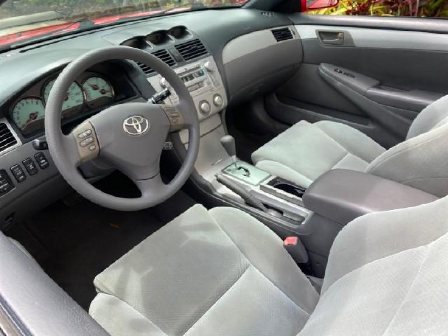 2004 Absolutely Red /Dark Stone Toyota Camry Solara CONV SE 1 OWNER 74972 Mi (4T1FA38P64U) with an 3.3L DOHC SMPI VVT-i 24-Valve V6 Engine engine, Automatic transmission, located at 4701 North Dixie Hwy, Pompano Beach, FL, 33064, (954) 422-2889, 26.240938, -80.123474 - OUR WEBPAGE FLORIDACARS1.COM HAS OVER 100 PHOTOS AND FREE CARFAX LINK 2004 Toyota Camry Solara SE V6 Convertible 3.3L V6 F DOHC 24V Gasoline 29 MPG Front Wheel Drive Features ABS Brakes Air Conditioning Alloy Wheels AM/FM Stereo Automatic Transmission Cassette Player CD Audio Cloth Seats Cruise Cont- Photo#49