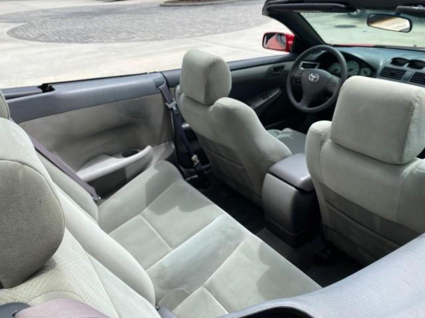 2004 Absolutely Red /Dark Stone Toyota Camry Solara CONV SE 1 OWNER 74972 Mi (4T1FA38P64U) with an 3.3L DOHC SMPI VVT-i 24-Valve V6 Engine engine, Automatic transmission, located at 4701 North Dixie Hwy, Pompano Beach, FL, 33064, (954) 422-2889, 26.240938, -80.123474 - OUR WEBPAGE FLORIDACARS1.COM HAS OVER 100 PHOTOS AND FREE CARFAX LINK 2004 Toyota Camry Solara SE V6 Convertible 3.3L V6 F DOHC 24V Gasoline 29 MPG Front Wheel Drive Features ABS Brakes Air Conditioning Alloy Wheels AM/FM Stereo Automatic Transmission Cassette Player CD Audio Cloth Seats Cruise Cont- Photo#55