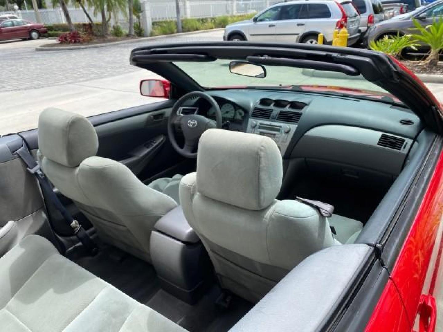 2004 Absolutely Red /Dark Stone Toyota Camry Solara CONV SE 1 OWNER 74972 Mi (4T1FA38P64U) with an 3.3L DOHC SMPI VVT-i 24-Valve V6 Engine engine, Automatic transmission, located at 4701 North Dixie Hwy, Pompano Beach, FL, 33064, (954) 422-2889, 26.240938, -80.123474 - OUR WEBPAGE FLORIDACARS1.COM HAS OVER 100 PHOTOS AND FREE CARFAX LINK 2004 Toyota Camry Solara SE V6 Convertible 3.3L V6 F DOHC 24V Gasoline 29 MPG Front Wheel Drive Features ABS Brakes Air Conditioning Alloy Wheels AM/FM Stereo Automatic Transmission Cassette Player CD Audio Cloth Seats Cruise Cont- Photo#56