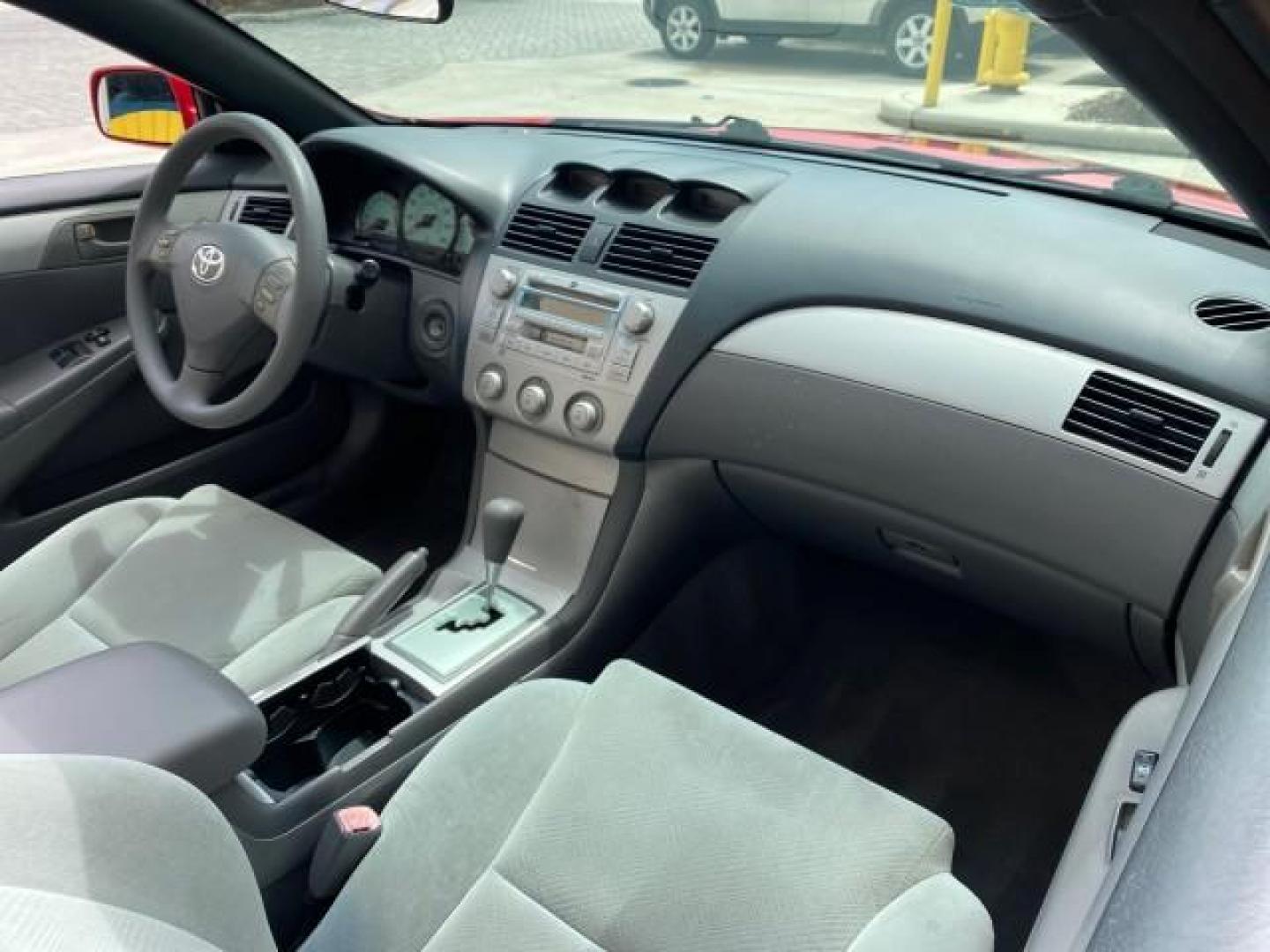 2004 Absolutely Red /Dark Stone Toyota Camry Solara CONV SE 1 OWNER 74972 Mi (4T1FA38P64U) with an 3.3L DOHC SMPI VVT-i 24-Valve V6 Engine engine, Automatic transmission, located at 4701 North Dixie Hwy, Pompano Beach, FL, 33064, (954) 422-2889, 26.240938, -80.123474 - OUR WEBPAGE FLORIDACARS1.COM HAS OVER 100 PHOTOS AND FREE CARFAX LINK 2004 Toyota Camry Solara SE V6 Convertible 3.3L V6 F DOHC 24V Gasoline 29 MPG Front Wheel Drive Features ABS Brakes Air Conditioning Alloy Wheels AM/FM Stereo Automatic Transmission Cassette Player CD Audio Cloth Seats Cruise Cont- Photo#57