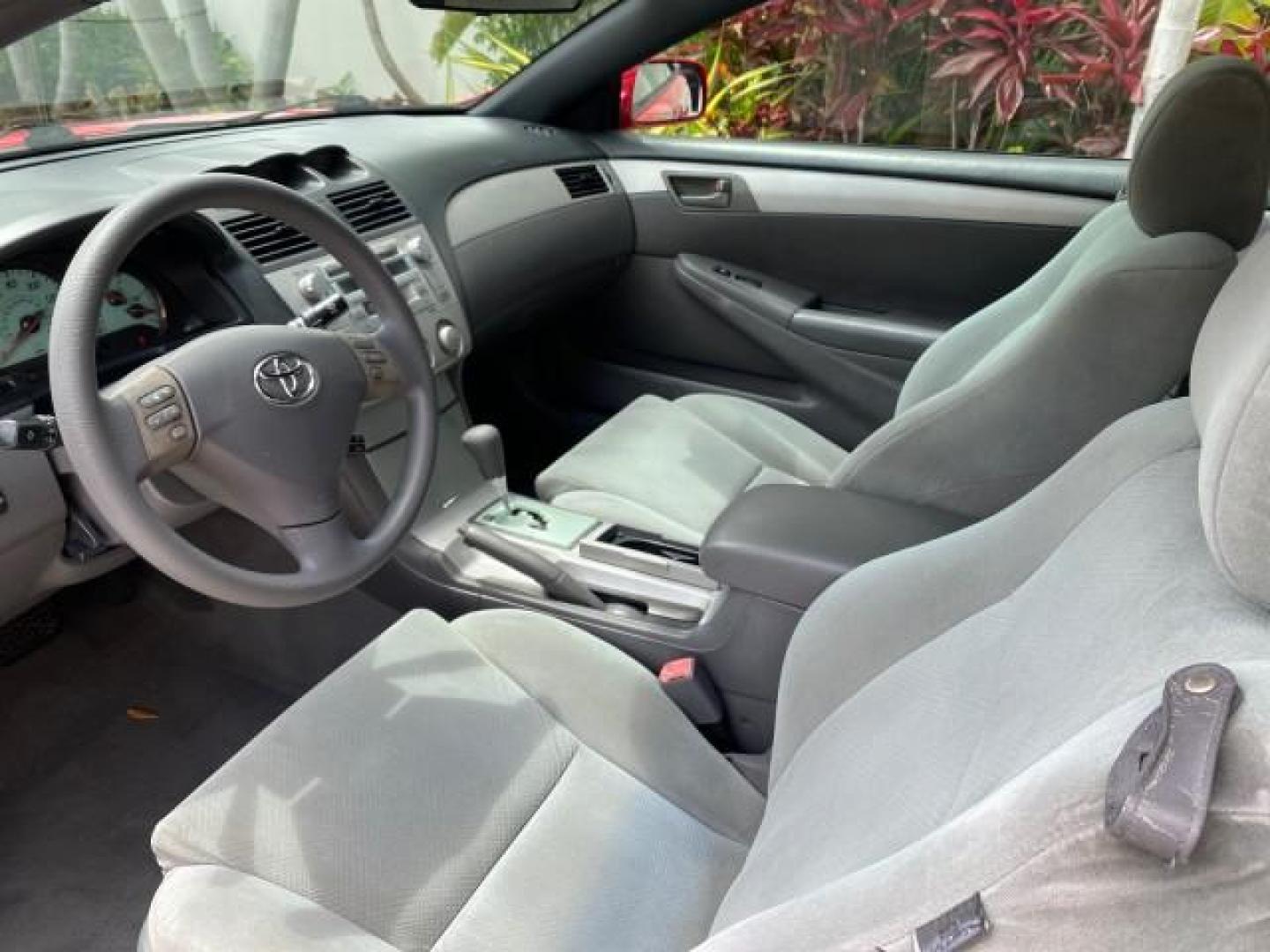 2004 Absolutely Red /Dark Stone Toyota Camry Solara CONV SE 1 OWNER 74972 Mi (4T1FA38P64U) with an 3.3L DOHC SMPI VVT-i 24-Valve V6 Engine engine, Automatic transmission, located at 4701 North Dixie Hwy, Pompano Beach, FL, 33064, (954) 422-2889, 26.240938, -80.123474 - OUR WEBPAGE FLORIDACARS1.COM HAS OVER 100 PHOTOS AND FREE CARFAX LINK 2004 Toyota Camry Solara SE V6 Convertible 3.3L V6 F DOHC 24V Gasoline 29 MPG Front Wheel Drive Features ABS Brakes Air Conditioning Alloy Wheels AM/FM Stereo Automatic Transmission Cassette Player CD Audio Cloth Seats Cruise Cont- Photo#67