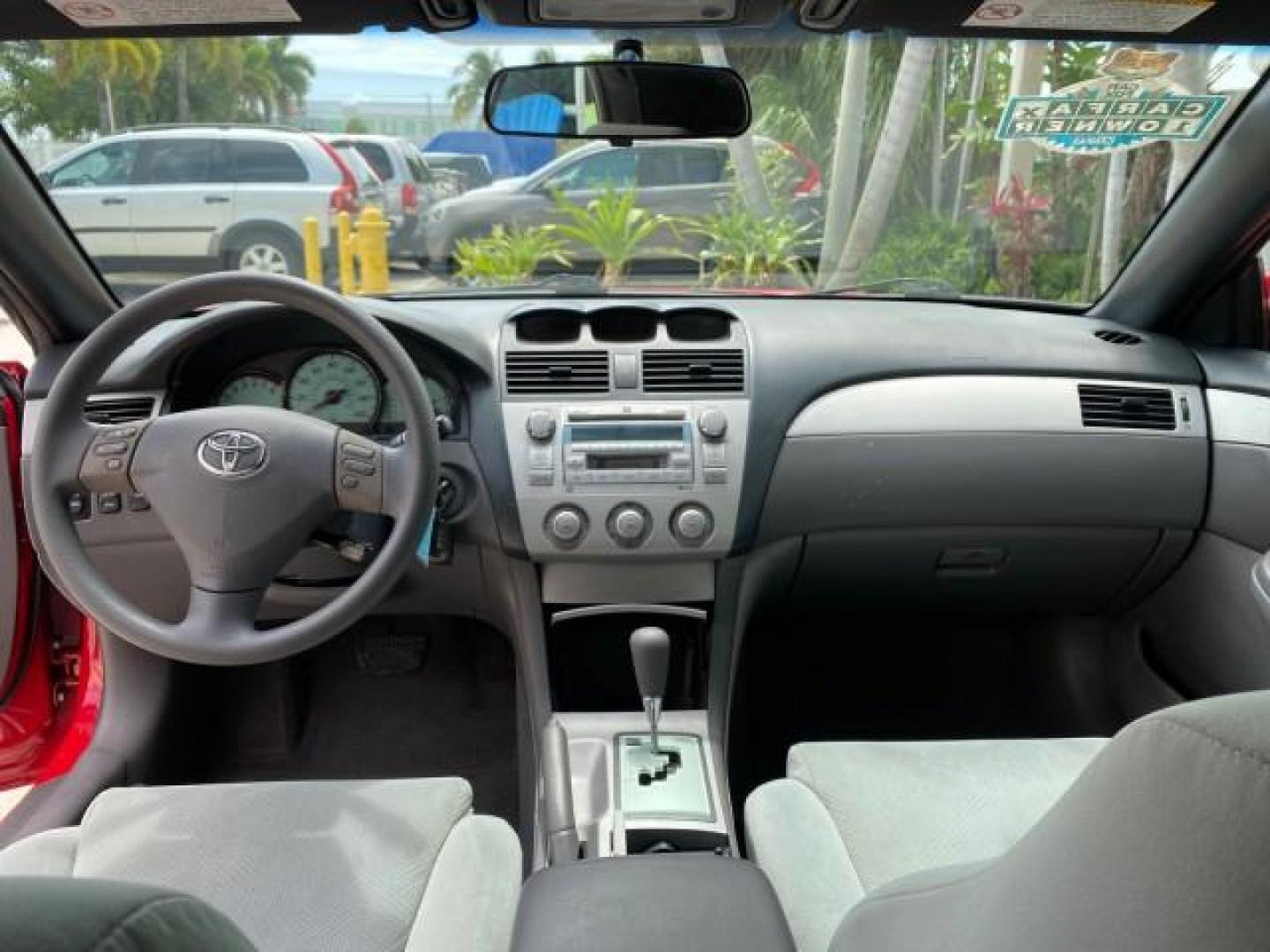 2004 Absolutely Red /Dark Stone Toyota Camry Solara CONV SE 1 OWNER 74972 Mi (4T1FA38P64U) with an 3.3L DOHC SMPI VVT-i 24-Valve V6 Engine engine, Automatic transmission, located at 4701 North Dixie Hwy, Pompano Beach, FL, 33064, (954) 422-2889, 26.240938, -80.123474 - OUR WEBPAGE FLORIDACARS1.COM HAS OVER 100 PHOTOS AND FREE CARFAX LINK 2004 Toyota Camry Solara SE V6 Convertible 3.3L V6 F DOHC 24V Gasoline 29 MPG Front Wheel Drive Features ABS Brakes Air Conditioning Alloy Wheels AM/FM Stereo Automatic Transmission Cassette Player CD Audio Cloth Seats Cruise Cont- Photo#99
