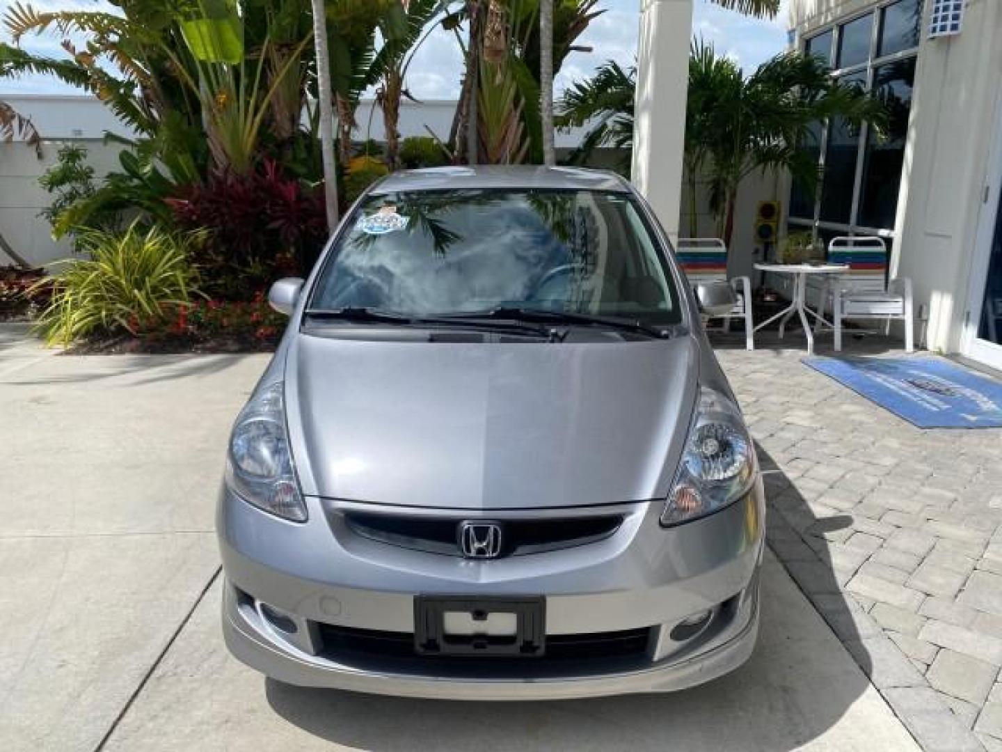 2007 Storm Silver Metallic /Black Honda Fit FIT Sport 1 OWNER LOW MILES 22,306 (JHMGD38607S) with an 1.5L SOHC PGM-FI 16-Valve VTEC I4 Engine engine, Automatic transmission, located at 4701 North Dixie Hwy, Pompano Beach, FL, 33064, (954) 422-2889, 26.240938, -80.123474 - OUR WEBPAGE FLORIDACARS1.COM HAS OVER 100 PHOTOS AND FREE CARFAX LINK 2007 Honda Fit Sport 1 OWNER Hatchback 4 DR 1.5L I4 F SOHC Gasoline 37 MPG Front Wheel Drive Features ABS Brakes Air Conditioning Alloy Wheels AM/FM Stereo Automatic Transmission Auxiliary Audio Input CD Audio Cloth Seats Cruise C- Photo#2