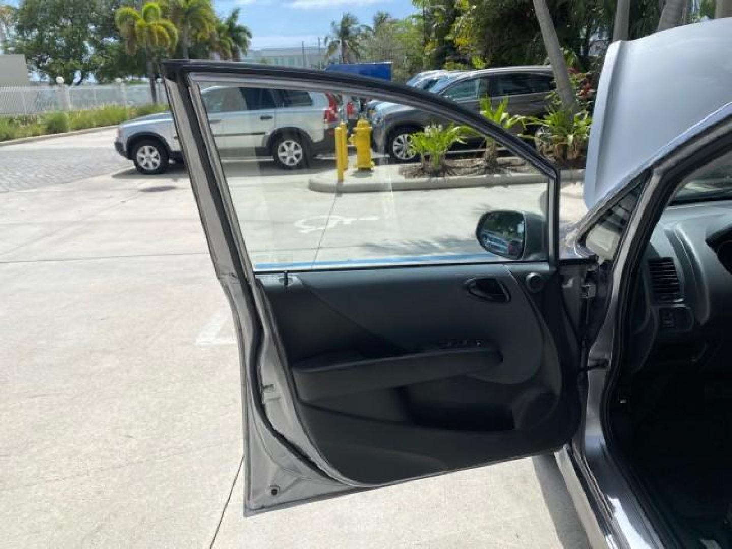 2007 Storm Silver Metallic /Black Honda Fit FIT Sport 1 OWNER LOW MILES 22,306 (JHMGD38607S) with an 1.5L SOHC PGM-FI 16-Valve VTEC I4 Engine engine, Automatic transmission, located at 4701 North Dixie Hwy, Pompano Beach, FL, 33064, (954) 422-2889, 26.240938, -80.123474 - OUR WEBPAGE FLORIDACARS1.COM HAS OVER 100 PHOTOS AND FREE CARFAX LINK 2007 Honda Fit Sport 1 OWNER Hatchback 4 DR 1.5L I4 F SOHC Gasoline 37 MPG Front Wheel Drive Features ABS Brakes Air Conditioning Alloy Wheels AM/FM Stereo Automatic Transmission Auxiliary Audio Input CD Audio Cloth Seats Cruise C- Photo#9