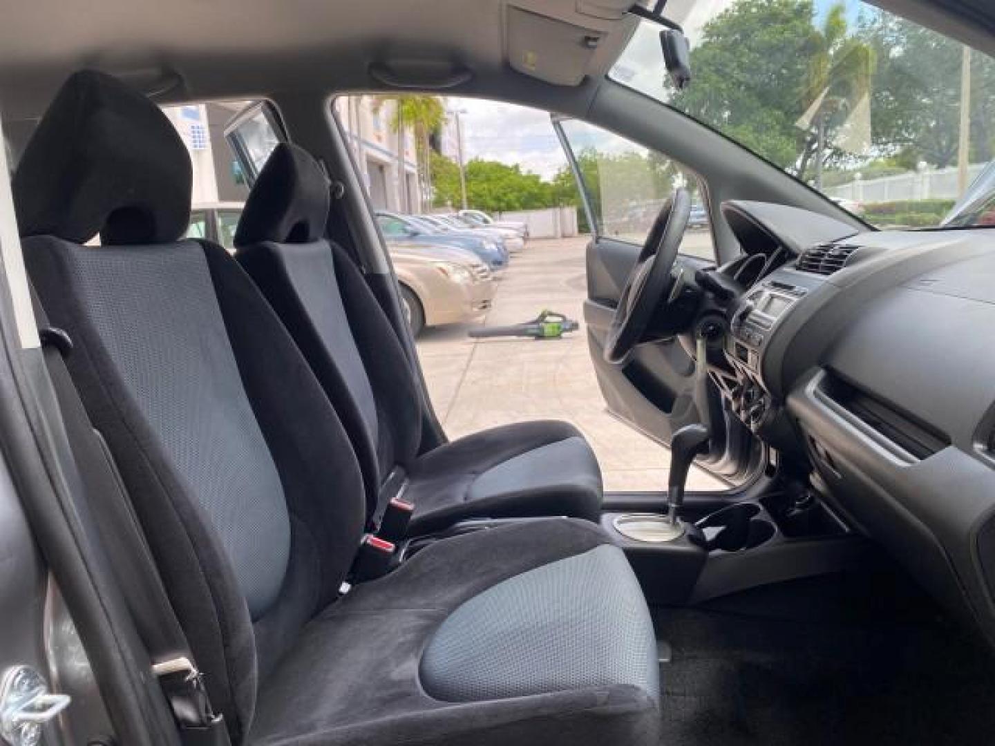 2007 Storm Silver Metallic /Black Honda Fit FIT Sport 1 OWNER LOW MILES 22,306 (JHMGD38607S) with an 1.5L SOHC PGM-FI 16-Valve VTEC I4 Engine engine, Automatic transmission, located at 4701 North Dixie Hwy, Pompano Beach, FL, 33064, (954) 422-2889, 26.240938, -80.123474 - OUR WEBPAGE FLORIDACARS1.COM HAS OVER 100 PHOTOS AND FREE CARFAX LINK 2007 Honda Fit Sport 1 OWNER Hatchback 4 DR 1.5L I4 F SOHC Gasoline 37 MPG Front Wheel Drive Features ABS Brakes Air Conditioning Alloy Wheels AM/FM Stereo Automatic Transmission Auxiliary Audio Input CD Audio Cloth Seats Cruise C- Photo#12