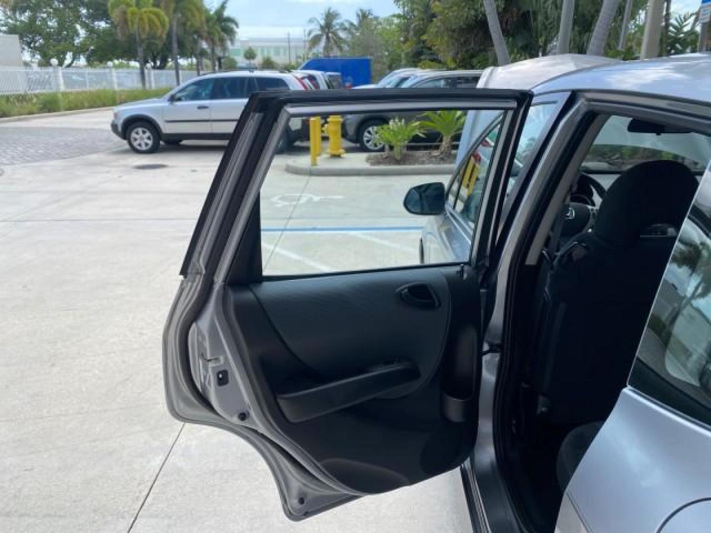 2007 Storm Silver Metallic /Black Honda Fit FIT Sport 1 OWNER LOW MILES 22,306 (JHMGD38607S) with an 1.5L SOHC PGM-FI 16-Valve VTEC I4 Engine engine, Automatic transmission, located at 4701 North Dixie Hwy, Pompano Beach, FL, 33064, (954) 422-2889, 26.240938, -80.123474 - OUR WEBPAGE FLORIDACARS1.COM HAS OVER 100 PHOTOS AND FREE CARFAX LINK 2007 Honda Fit Sport 1 OWNER Hatchback 4 DR 1.5L I4 F SOHC Gasoline 37 MPG Front Wheel Drive Features ABS Brakes Air Conditioning Alloy Wheels AM/FM Stereo Automatic Transmission Auxiliary Audio Input CD Audio Cloth Seats Cruise C- Photo#13