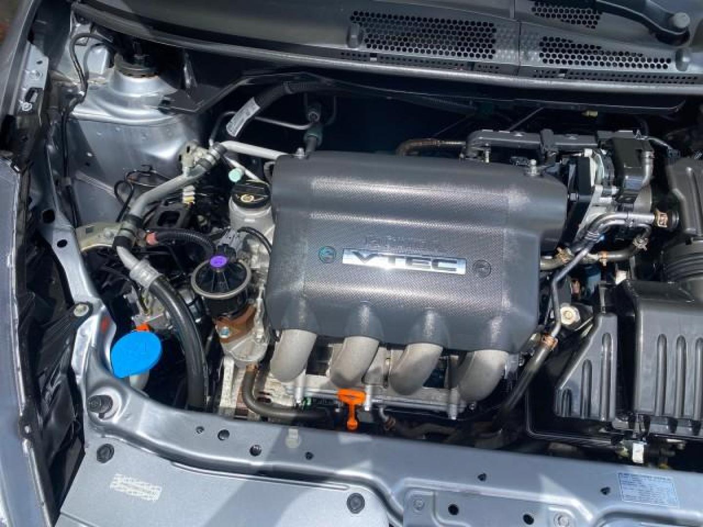 2007 Storm Silver Metallic /Black Honda Fit FIT Sport 1 OWNER LOW MILES 22,306 (JHMGD38607S) with an 1.5L SOHC PGM-FI 16-Valve VTEC I4 Engine engine, Automatic transmission, located at 4701 North Dixie Hwy, Pompano Beach, FL, 33064, (954) 422-2889, 26.240938, -80.123474 - OUR WEBPAGE FLORIDACARS1.COM HAS OVER 100 PHOTOS AND FREE CARFAX LINK 2007 Honda Fit Sport 1 OWNER Hatchback 4 DR 1.5L I4 F SOHC Gasoline 37 MPG Front Wheel Drive Features ABS Brakes Air Conditioning Alloy Wheels AM/FM Stereo Automatic Transmission Auxiliary Audio Input CD Audio Cloth Seats Cruise C- Photo#24