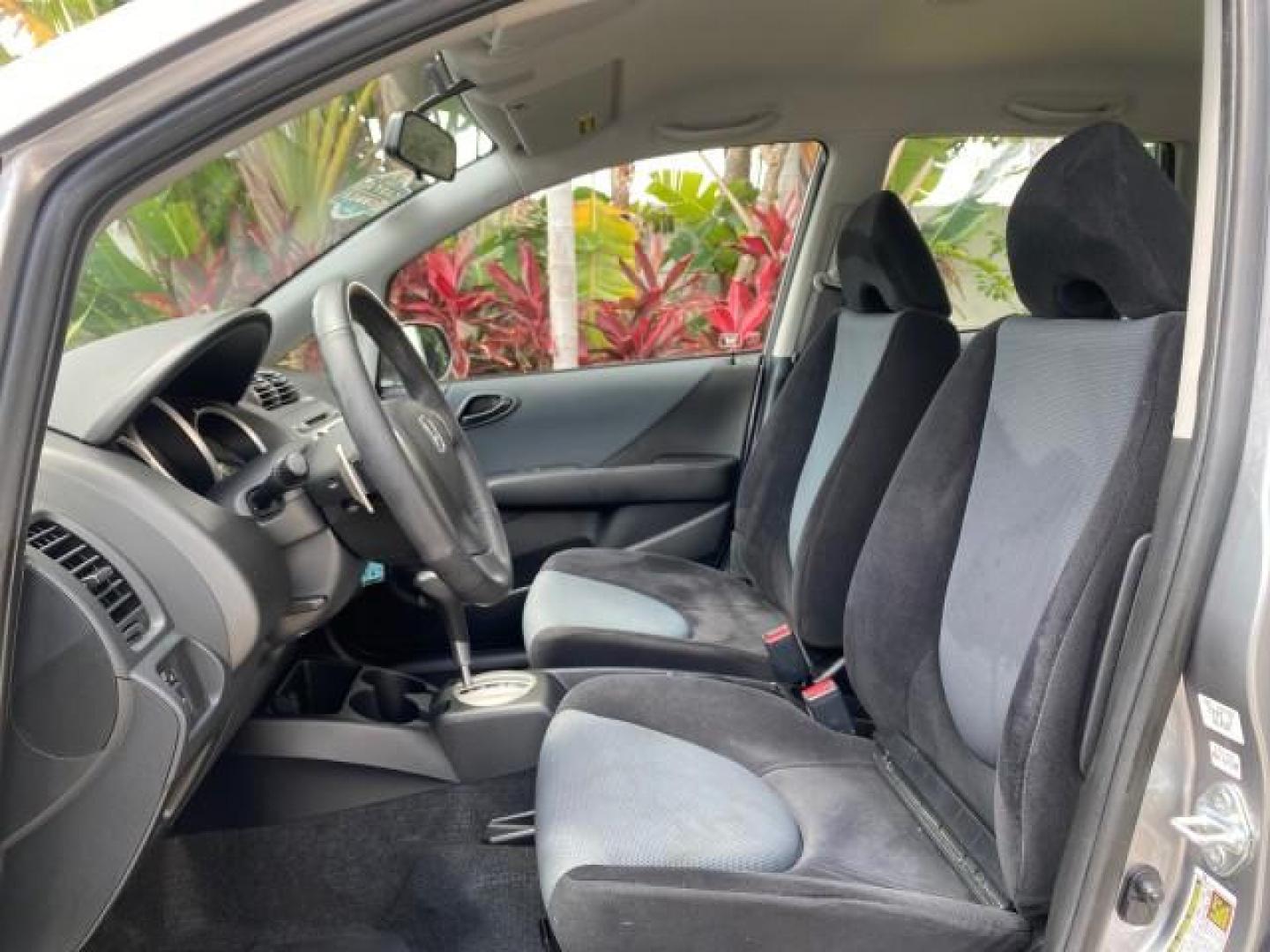 2007 Storm Silver Metallic /Black Honda Fit FIT Sport 1 OWNER LOW MILES 22,306 (JHMGD38607S) with an 1.5L SOHC PGM-FI 16-Valve VTEC I4 Engine engine, Automatic transmission, located at 4701 North Dixie Hwy, Pompano Beach, FL, 33064, (954) 422-2889, 26.240938, -80.123474 - OUR WEBPAGE FLORIDACARS1.COM HAS OVER 100 PHOTOS AND FREE CARFAX LINK 2007 Honda Fit Sport 1 OWNER Hatchback 4 DR 1.5L I4 F SOHC Gasoline 37 MPG Front Wheel Drive Features ABS Brakes Air Conditioning Alloy Wheels AM/FM Stereo Automatic Transmission Auxiliary Audio Input CD Audio Cloth Seats Cruise C- Photo#41