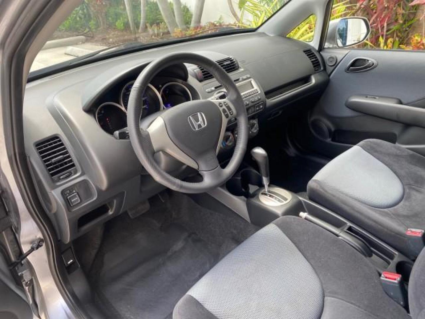 2007 Storm Silver Metallic /Black Honda Fit FIT Sport 1 OWNER LOW MILES 22,306 (JHMGD38607S) with an 1.5L SOHC PGM-FI 16-Valve VTEC I4 Engine engine, Automatic transmission, located at 4701 North Dixie Hwy, Pompano Beach, FL, 33064, (954) 422-2889, 26.240938, -80.123474 - OUR WEBPAGE FLORIDACARS1.COM HAS OVER 100 PHOTOS AND FREE CARFAX LINK 2007 Honda Fit Sport 1 OWNER Hatchback 4 DR 1.5L I4 F SOHC Gasoline 37 MPG Front Wheel Drive Features ABS Brakes Air Conditioning Alloy Wheels AM/FM Stereo Automatic Transmission Auxiliary Audio Input CD Audio Cloth Seats Cruise C- Photo#46
