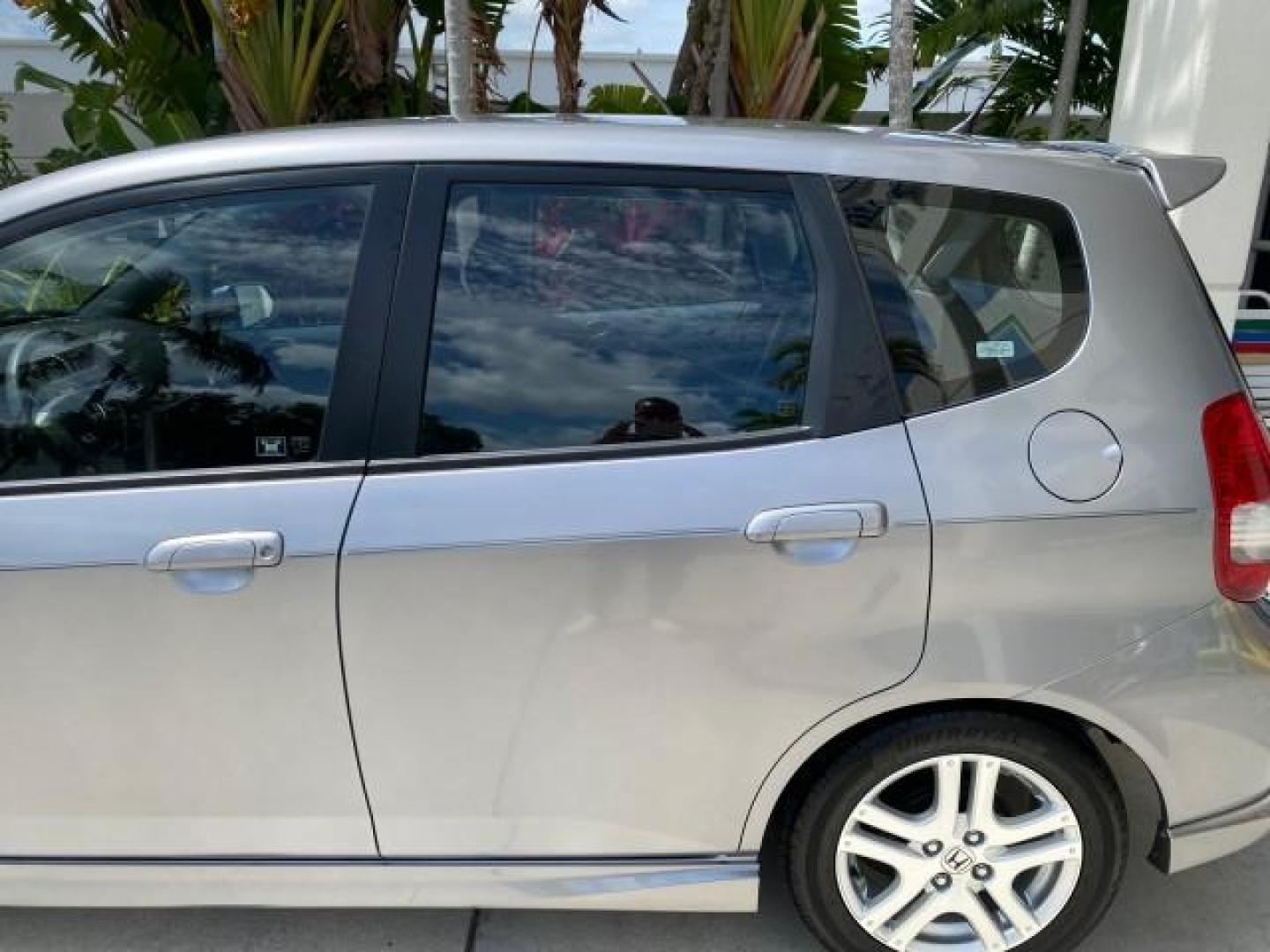 2007 Storm Silver Metallic /Black Honda Fit FIT Sport 1 OWNER LOW MILES 22,306 (JHMGD38607S) with an 1.5L SOHC PGM-FI 16-Valve VTEC I4 Engine engine, Automatic transmission, located at 4701 North Dixie Hwy, Pompano Beach, FL, 33064, (954) 422-2889, 26.240938, -80.123474 - OUR WEBPAGE FLORIDACARS1.COM HAS OVER 100 PHOTOS AND FREE CARFAX LINK 2007 Honda Fit Sport 1 OWNER Hatchback 4 DR 1.5L I4 F SOHC Gasoline 37 MPG Front Wheel Drive Features ABS Brakes Air Conditioning Alloy Wheels AM/FM Stereo Automatic Transmission Auxiliary Audio Input CD Audio Cloth Seats Cruise C- Photo#68