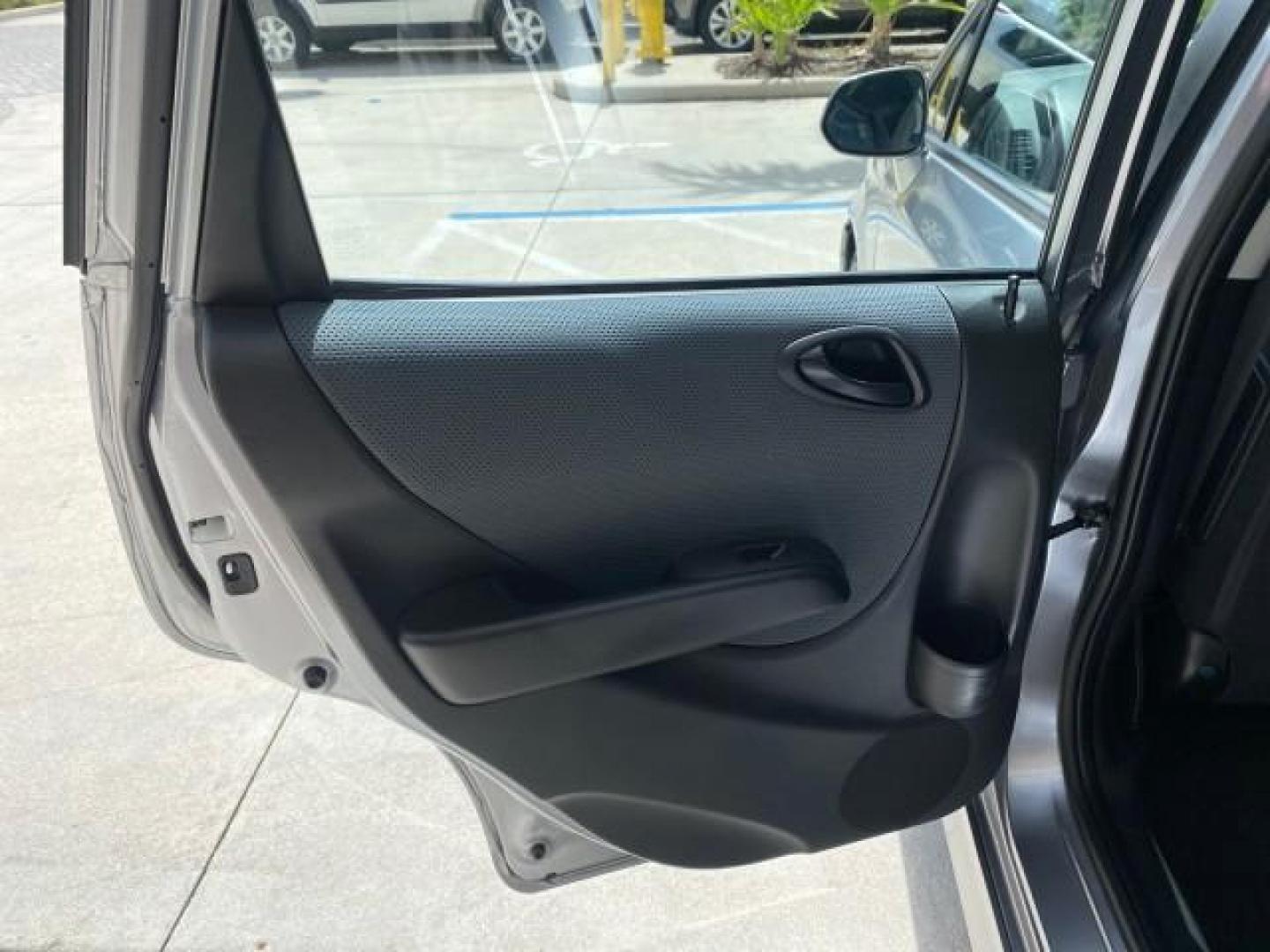 2007 Storm Silver Metallic /Black Honda Fit FIT Sport 1 OWNER LOW MILES 22,306 (JHMGD38607S) with an 1.5L SOHC PGM-FI 16-Valve VTEC I4 Engine engine, Automatic transmission, located at 4701 North Dixie Hwy, Pompano Beach, FL, 33064, (954) 422-2889, 26.240938, -80.123474 - OUR WEBPAGE FLORIDACARS1.COM HAS OVER 100 PHOTOS AND FREE CARFAX LINK 2007 Honda Fit Sport 1 OWNER Hatchback 4 DR 1.5L I4 F SOHC Gasoline 37 MPG Front Wheel Drive Features ABS Brakes Air Conditioning Alloy Wheels AM/FM Stereo Automatic Transmission Auxiliary Audio Input CD Audio Cloth Seats Cruise C- Photo#70