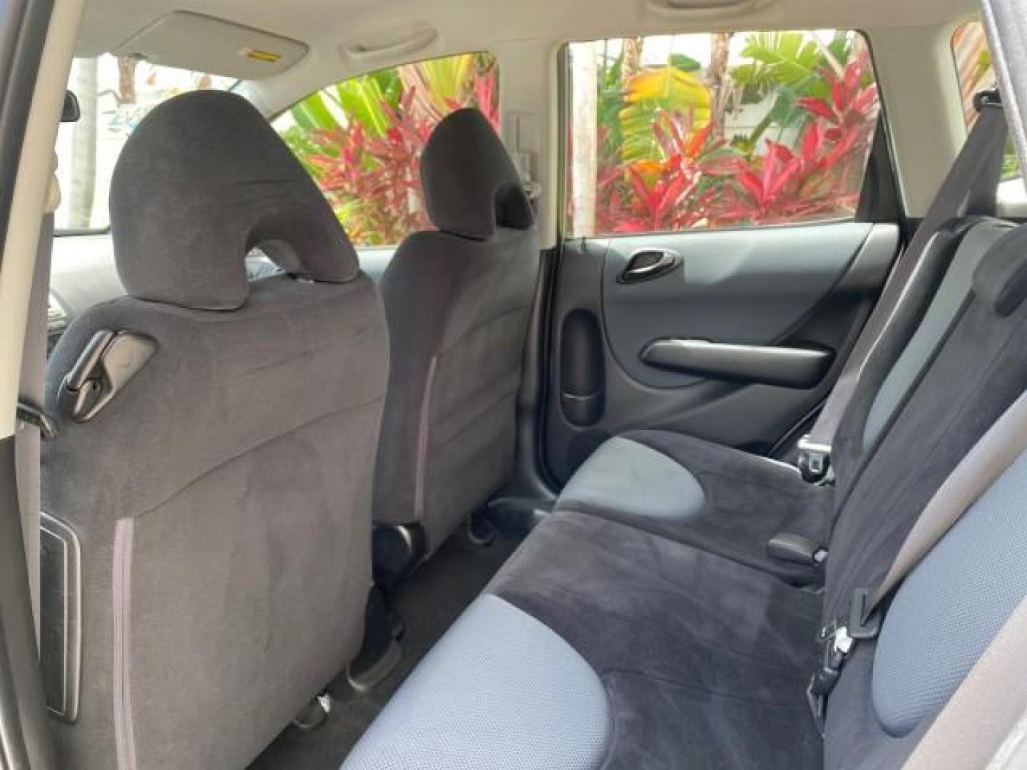 2007 Storm Silver Metallic /Black Honda Fit FIT Sport 1 OWNER LOW MILES 22,306 (JHMGD38607S) with an 1.5L SOHC PGM-FI 16-Valve VTEC I4 Engine engine, Automatic transmission, located at 4701 North Dixie Hwy, Pompano Beach, FL, 33064, (954) 422-2889, 26.240938, -80.123474 - OUR WEBPAGE FLORIDACARS1.COM HAS OVER 100 PHOTOS AND FREE CARFAX LINK 2007 Honda Fit Sport 1 OWNER Hatchback 4 DR 1.5L I4 F SOHC Gasoline 37 MPG Front Wheel Drive Features ABS Brakes Air Conditioning Alloy Wheels AM/FM Stereo Automatic Transmission Auxiliary Audio Input CD Audio Cloth Seats Cruise C- Photo#73