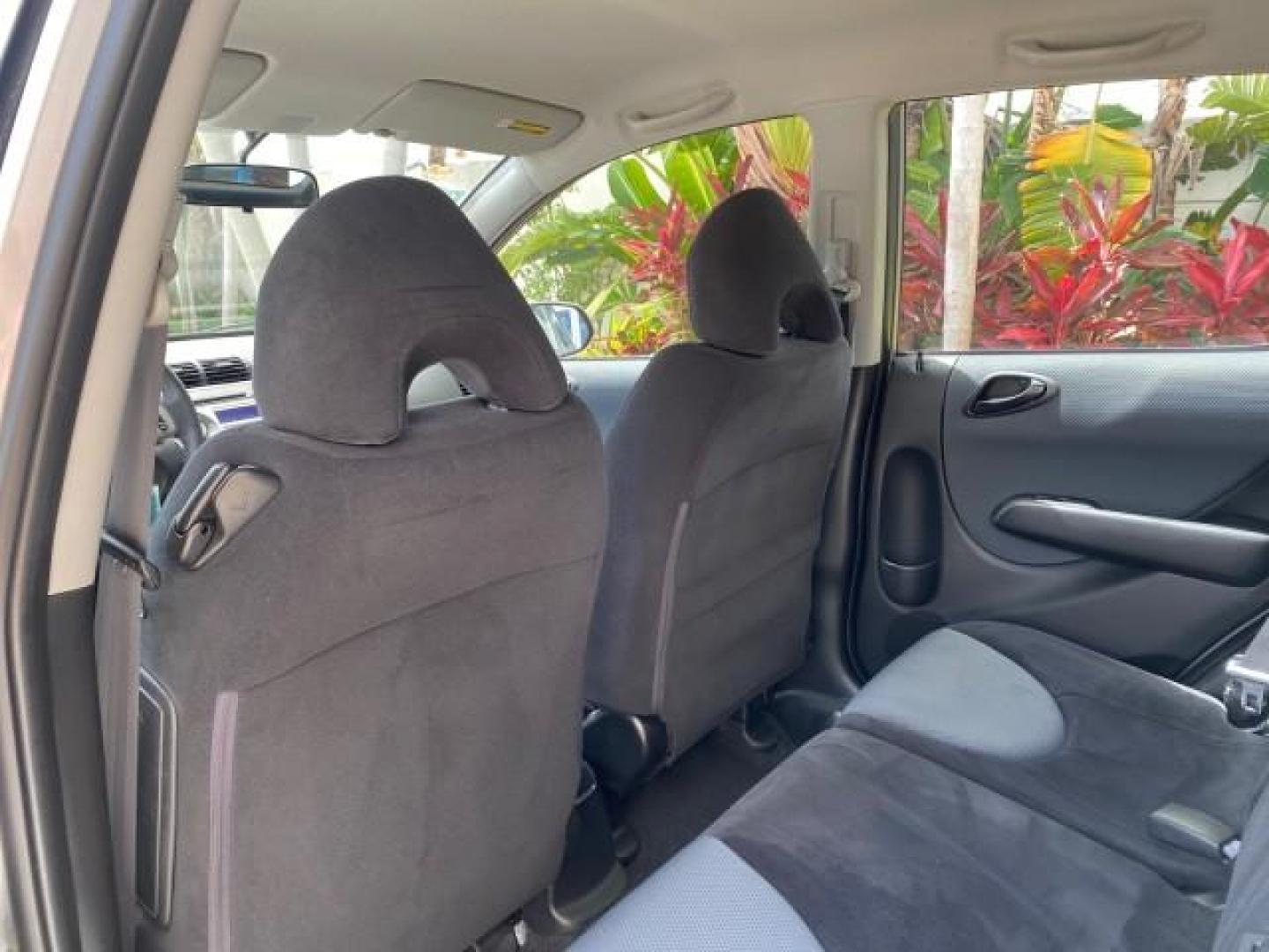 2007 Storm Silver Metallic /Black Honda Fit FIT Sport 1 OWNER LOW MILES 22,306 (JHMGD38607S) with an 1.5L SOHC PGM-FI 16-Valve VTEC I4 Engine engine, Automatic transmission, located at 4701 North Dixie Hwy, Pompano Beach, FL, 33064, (954) 422-2889, 26.240938, -80.123474 - OUR WEBPAGE FLORIDACARS1.COM HAS OVER 100 PHOTOS AND FREE CARFAX LINK 2007 Honda Fit Sport 1 OWNER Hatchback 4 DR 1.5L I4 F SOHC Gasoline 37 MPG Front Wheel Drive Features ABS Brakes Air Conditioning Alloy Wheels AM/FM Stereo Automatic Transmission Auxiliary Audio Input CD Audio Cloth Seats Cruise C- Photo#74
